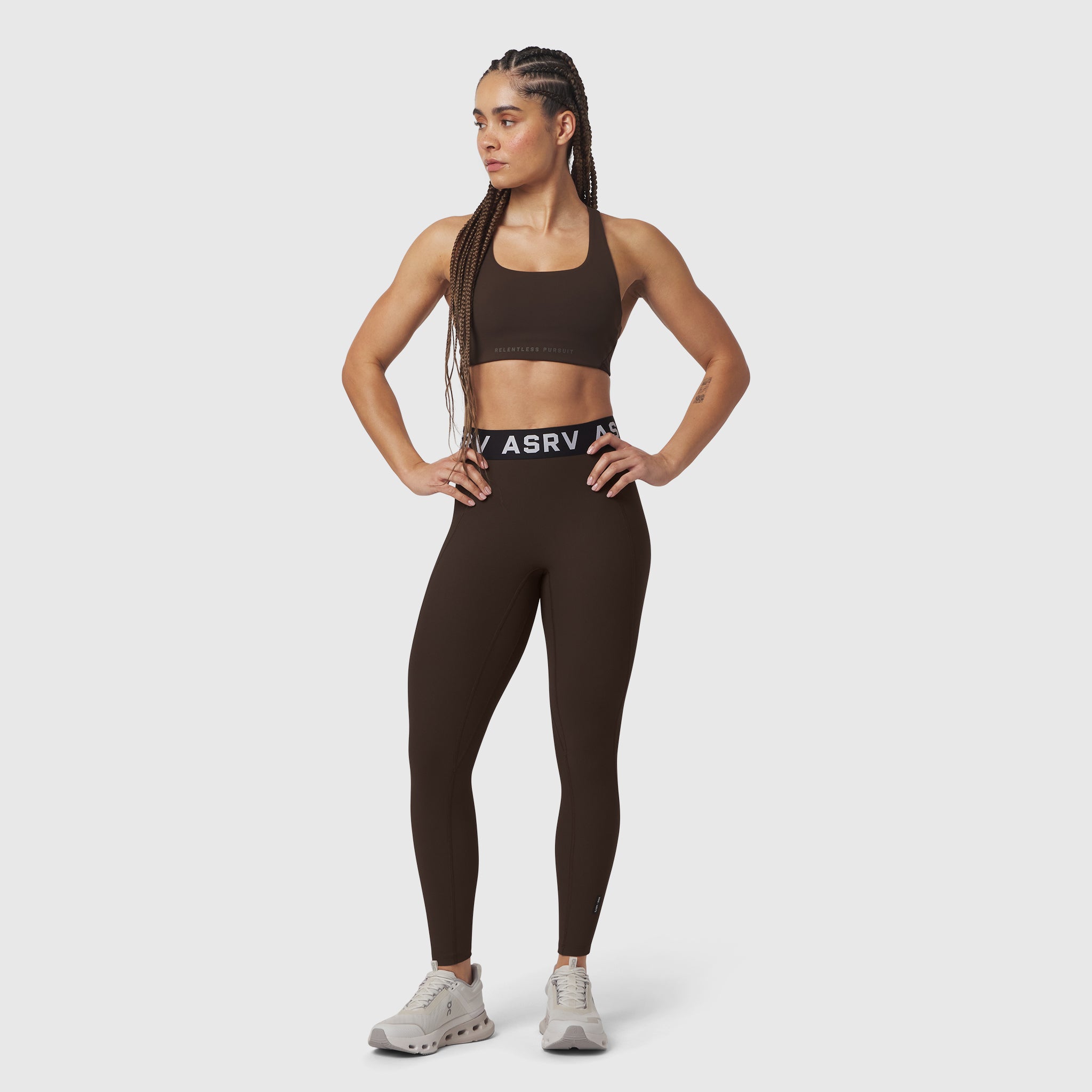 W071 Lycra Ribbed Legging in dark earth, worn by model in sports bra, front pose