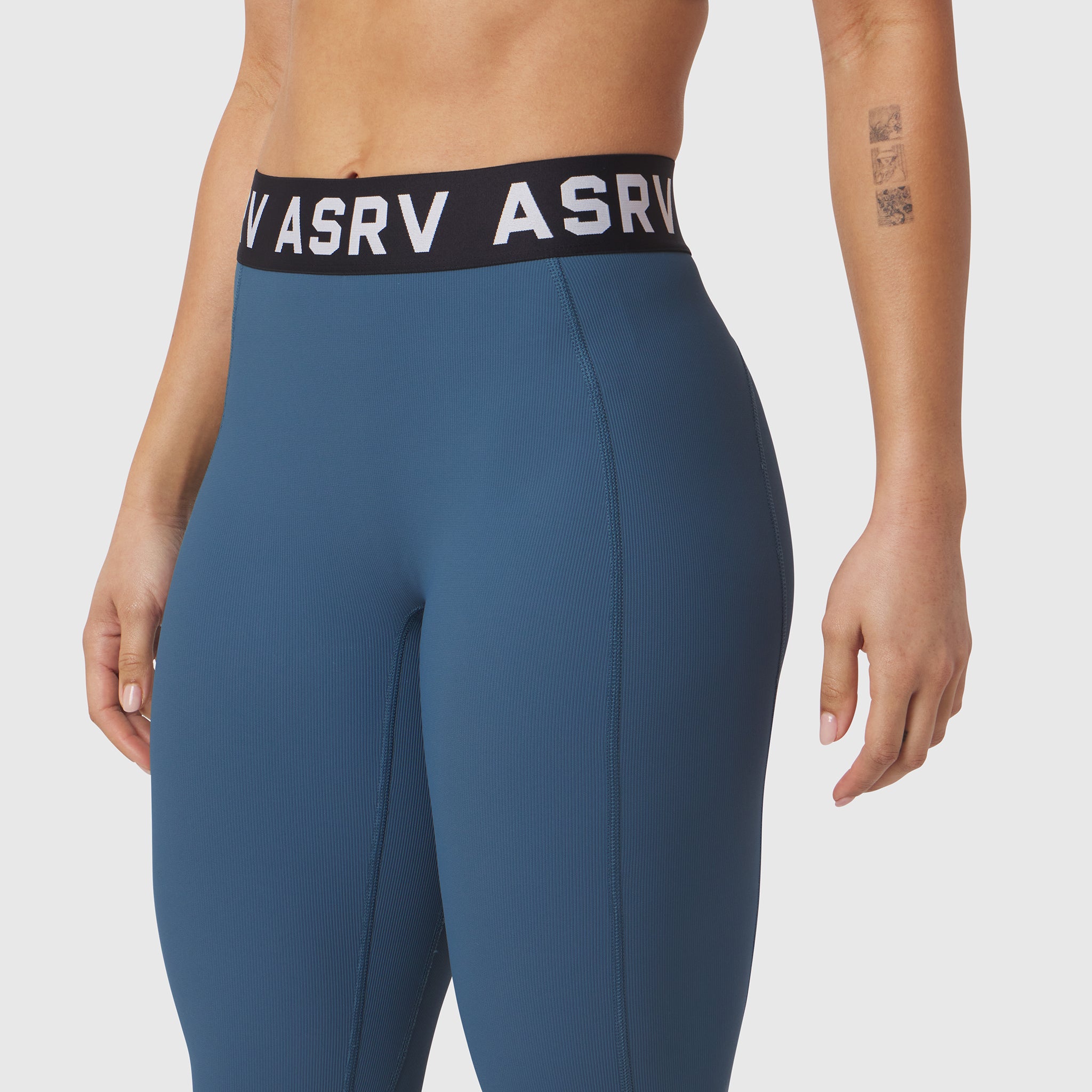 W071 LYCRA Ribbed Legging in storm blue, worn by model showing waistband detail