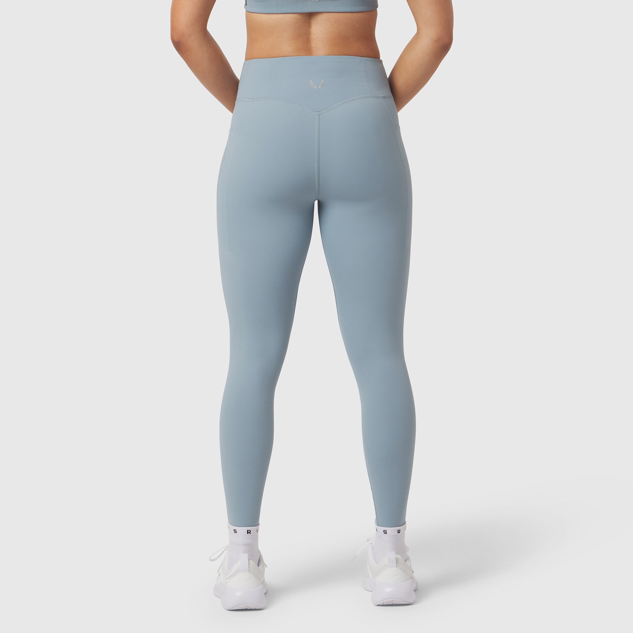 Light sky LYCRA® ADAPTIV 4 Pocket Legging worn by model, back view