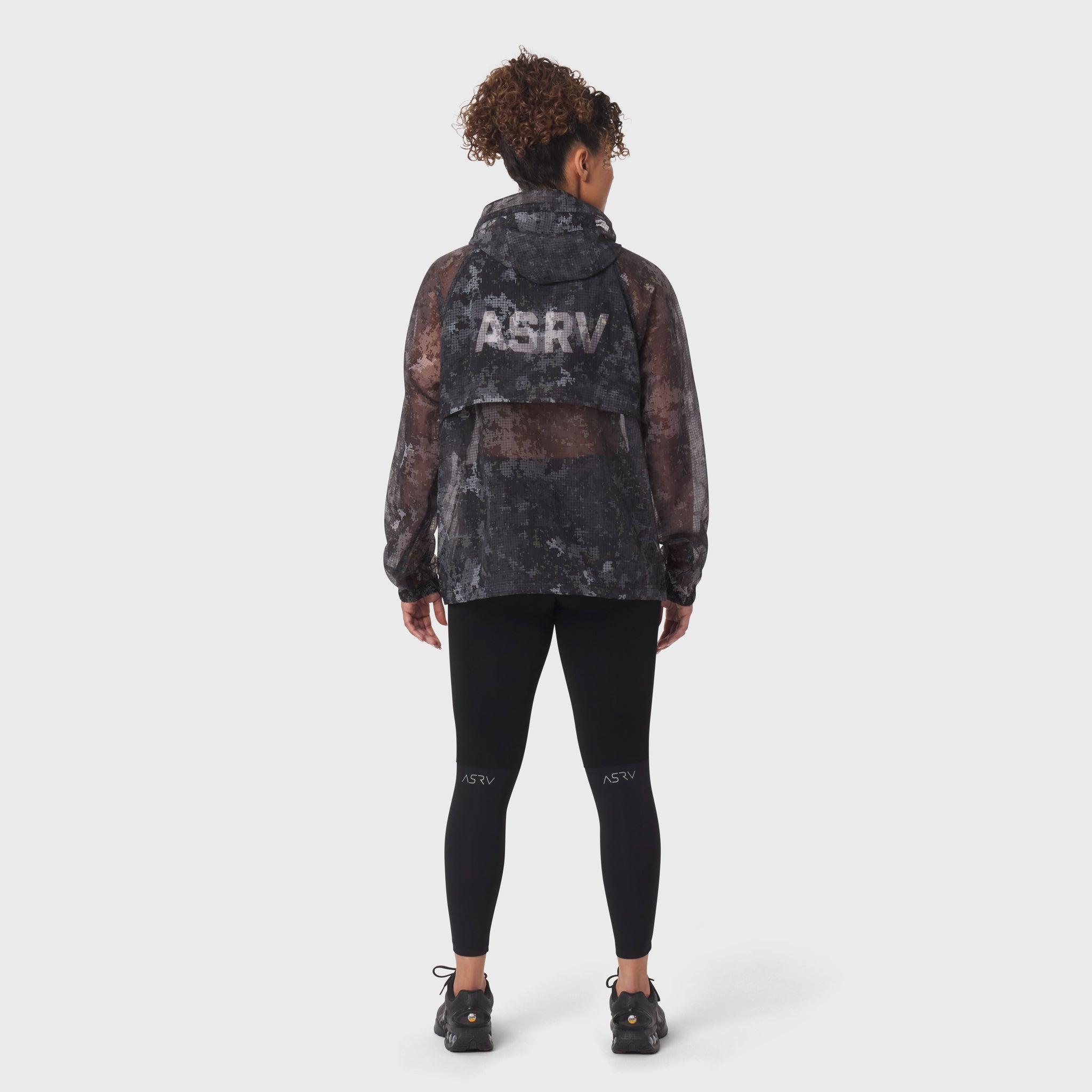 Weather-Ready Transparent Ripstop Shell Jacket in pixel camo, worn by model from back