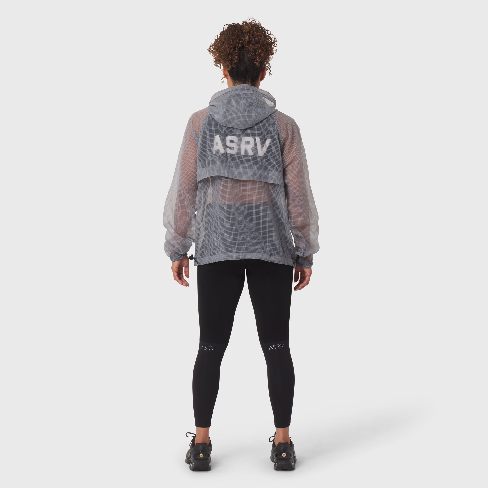 Weather-Ready Transparent Ripstop Shell Jacket in slate grey, worn by model from behind