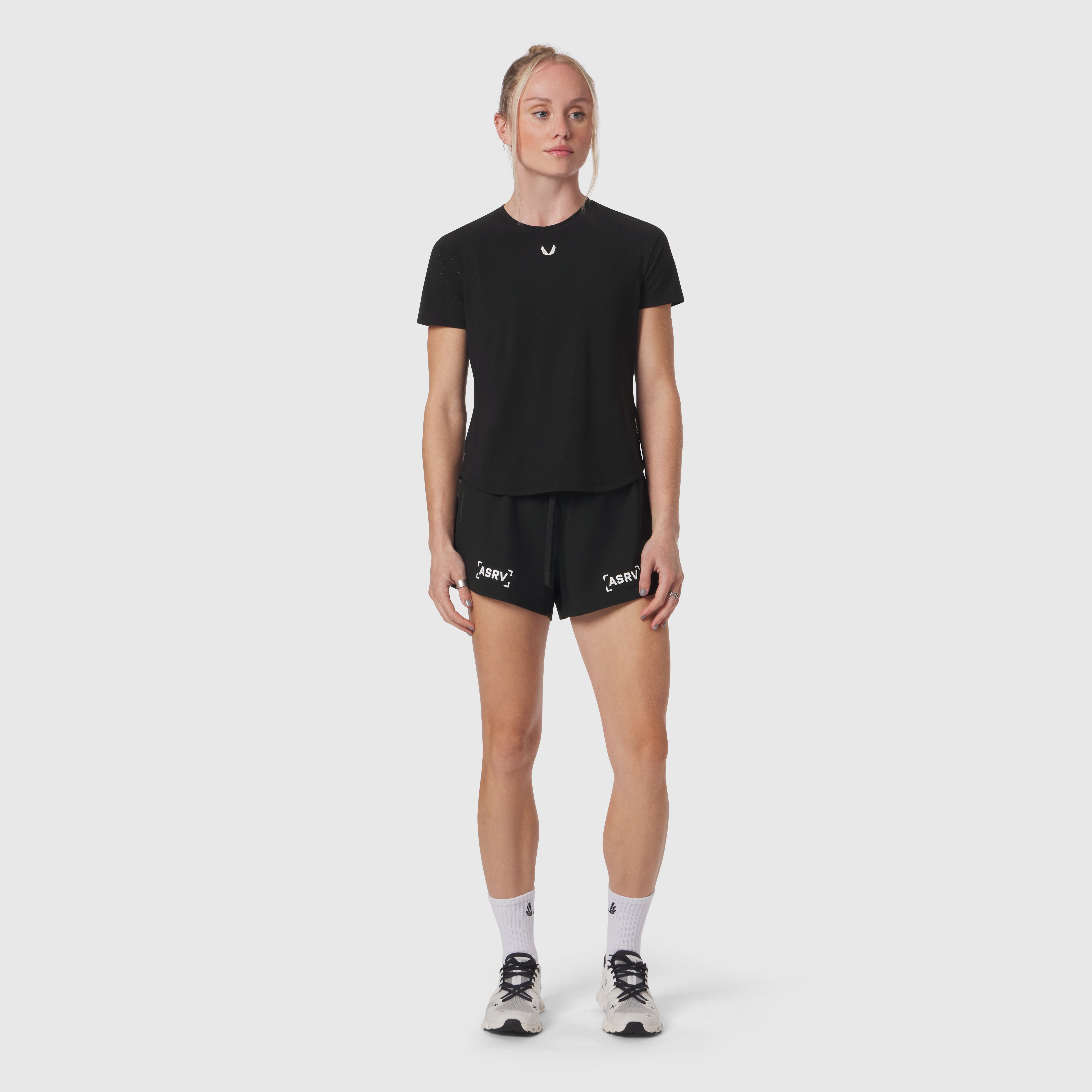 Black Laser-Vent™ Established Tee worn with black shorts, front view on model