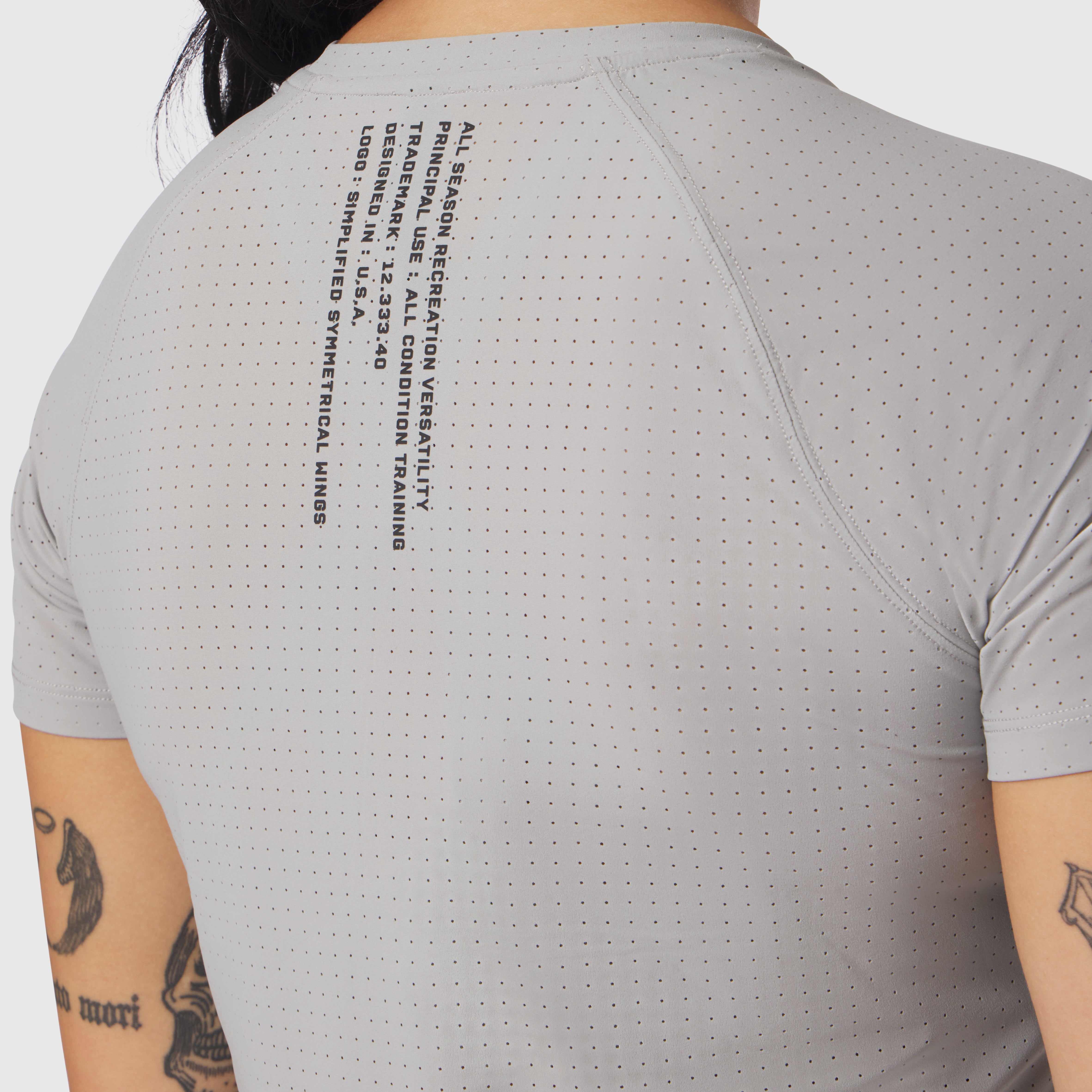Laser-Vent Established Tee in slate grey worn by model, back view showing perforated fabric