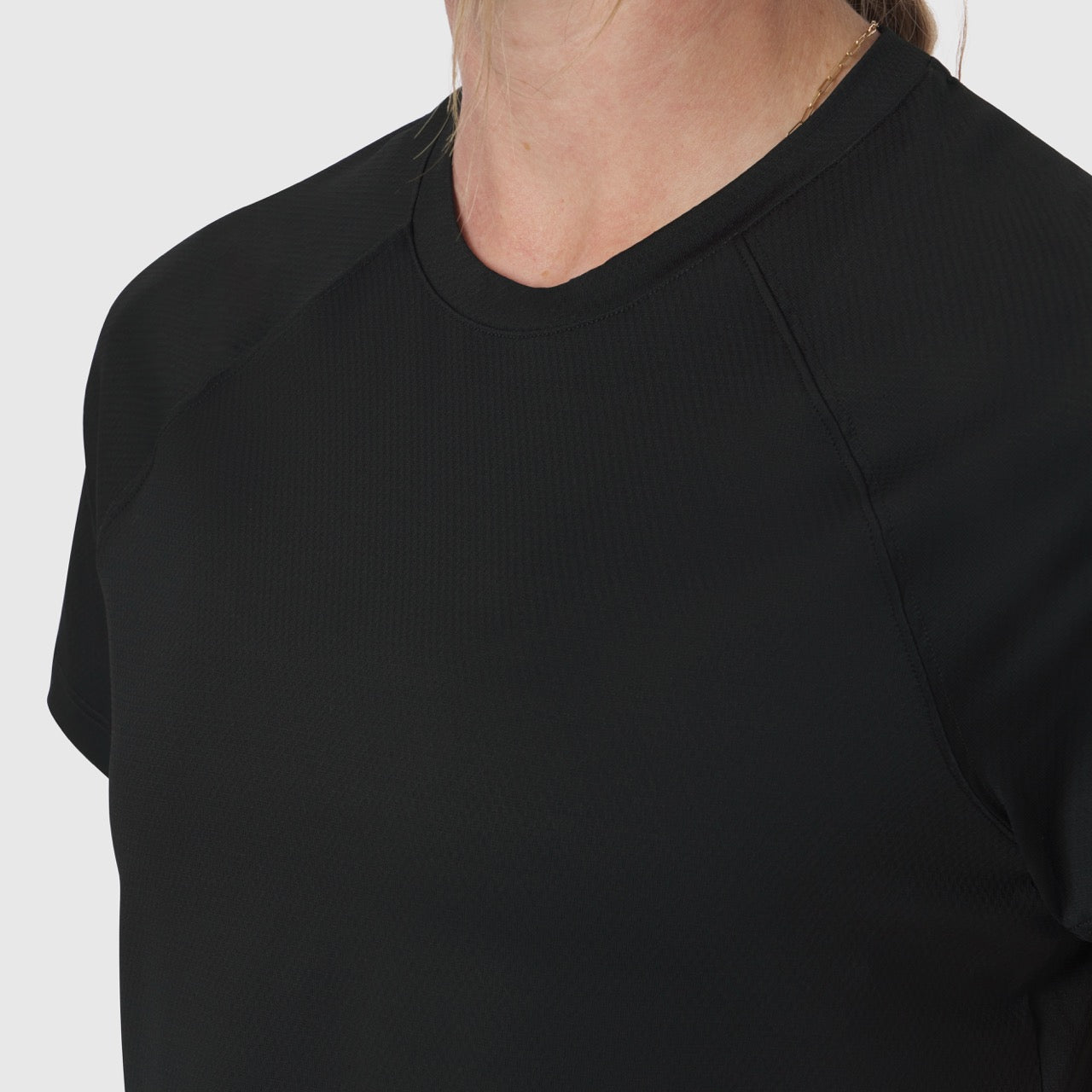 AeroSilver® Cropped Tee in black, worn by model showing front view and fit