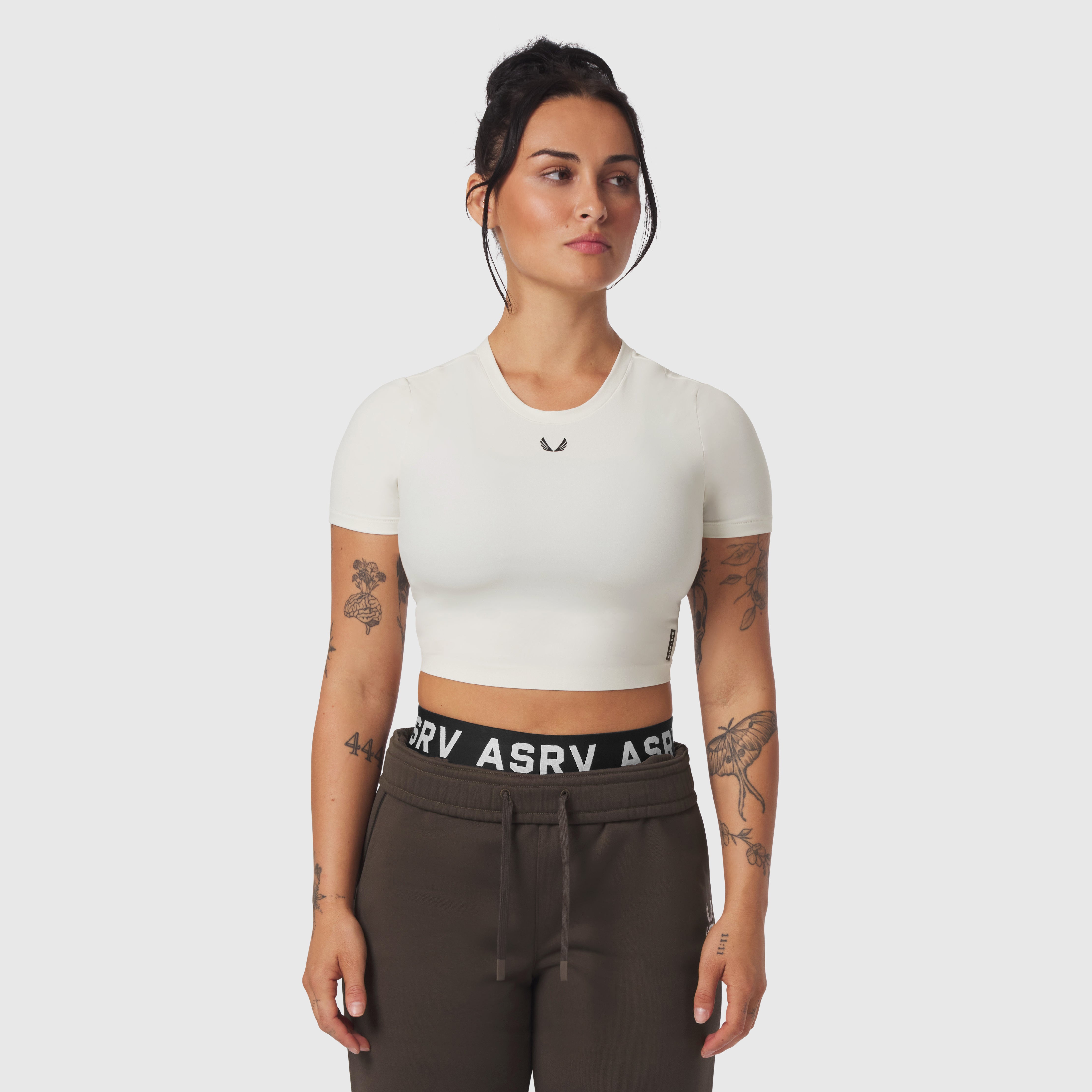 W019 LYCRA® Cropped Tee in ivory cream worn by model, front view
