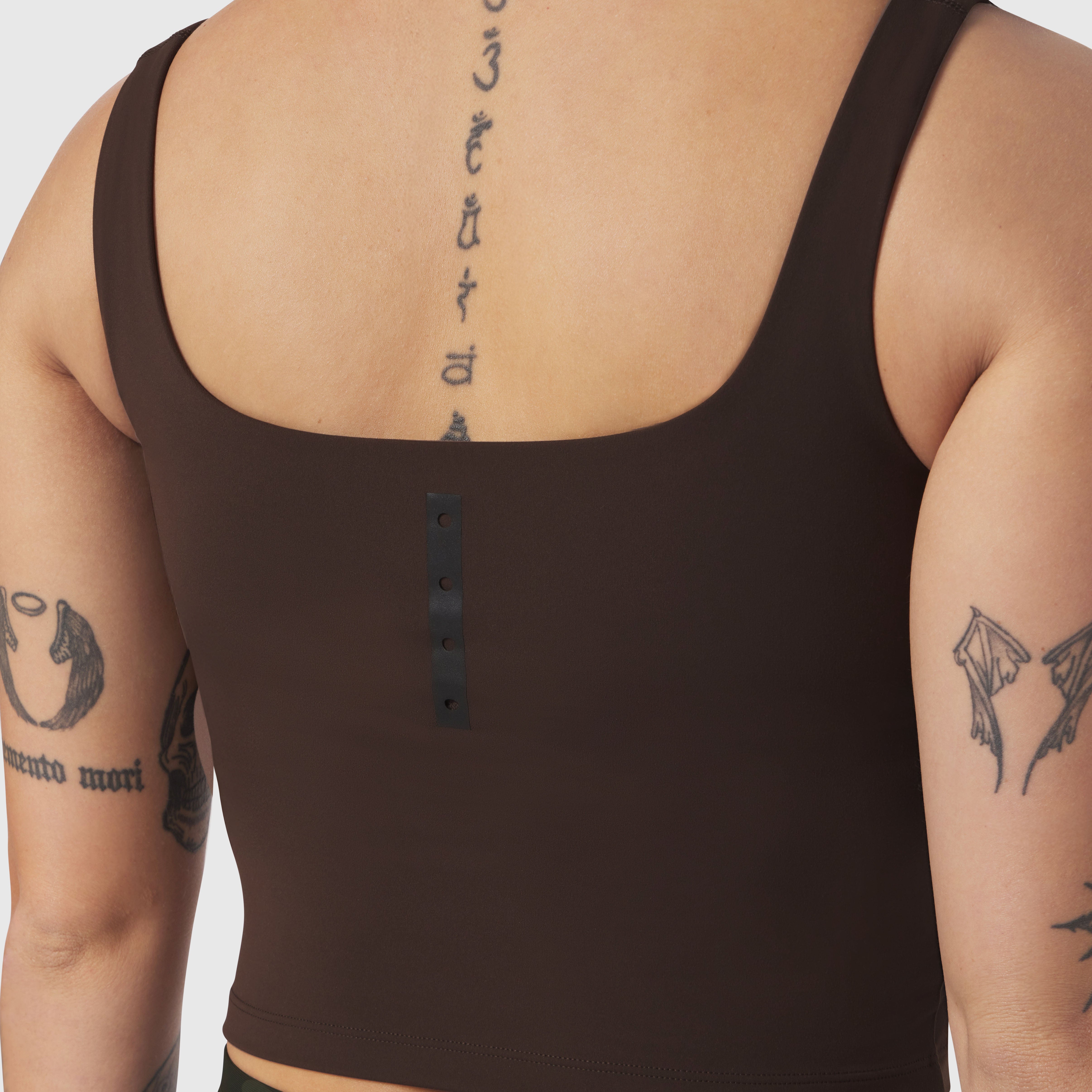 LYCRA® 2-in-1 Tank Top in Dark Earth, worn by model showing back view with tattoos