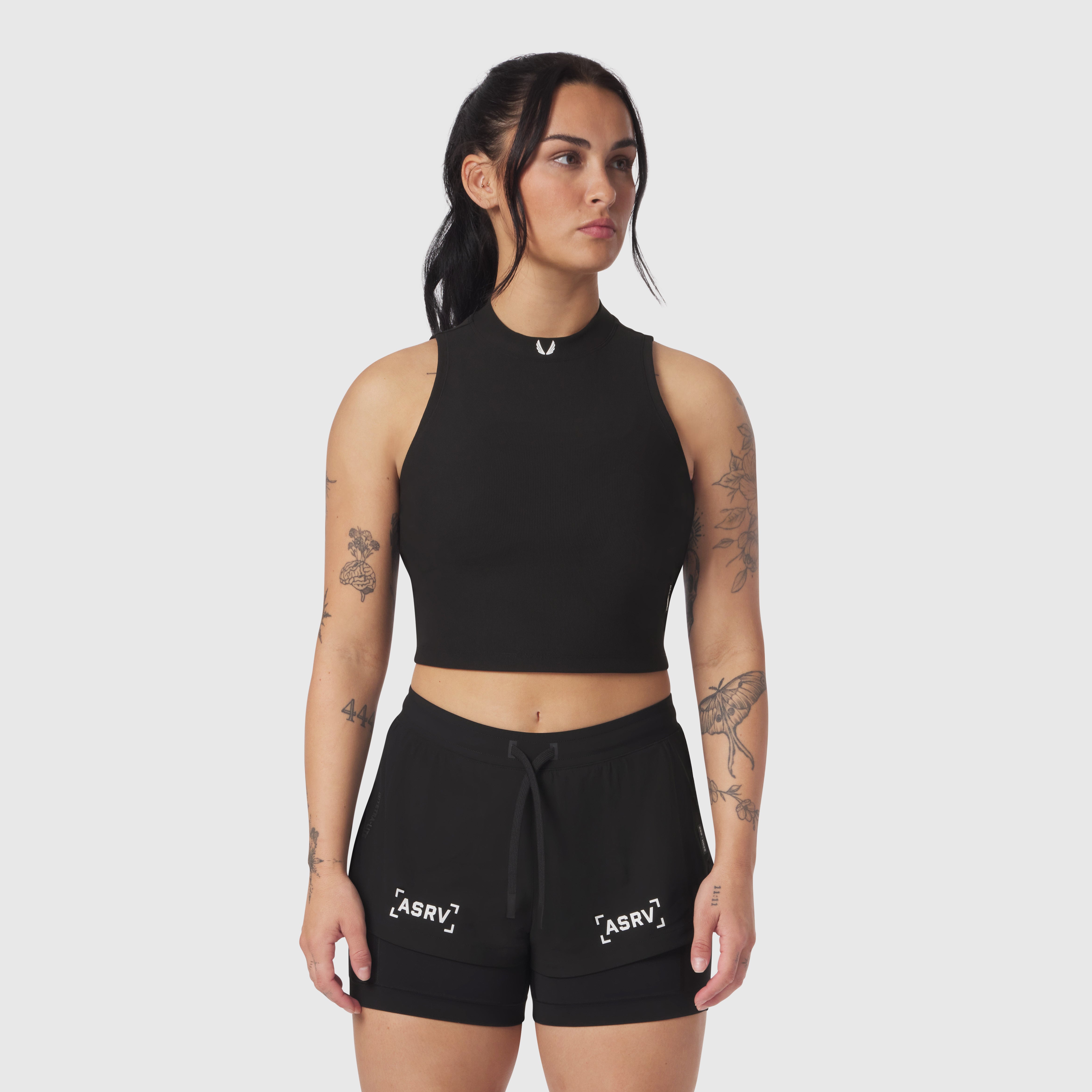 Black LYCRA® Ribbed Mockneck Tank worn with matching black shorts, front view