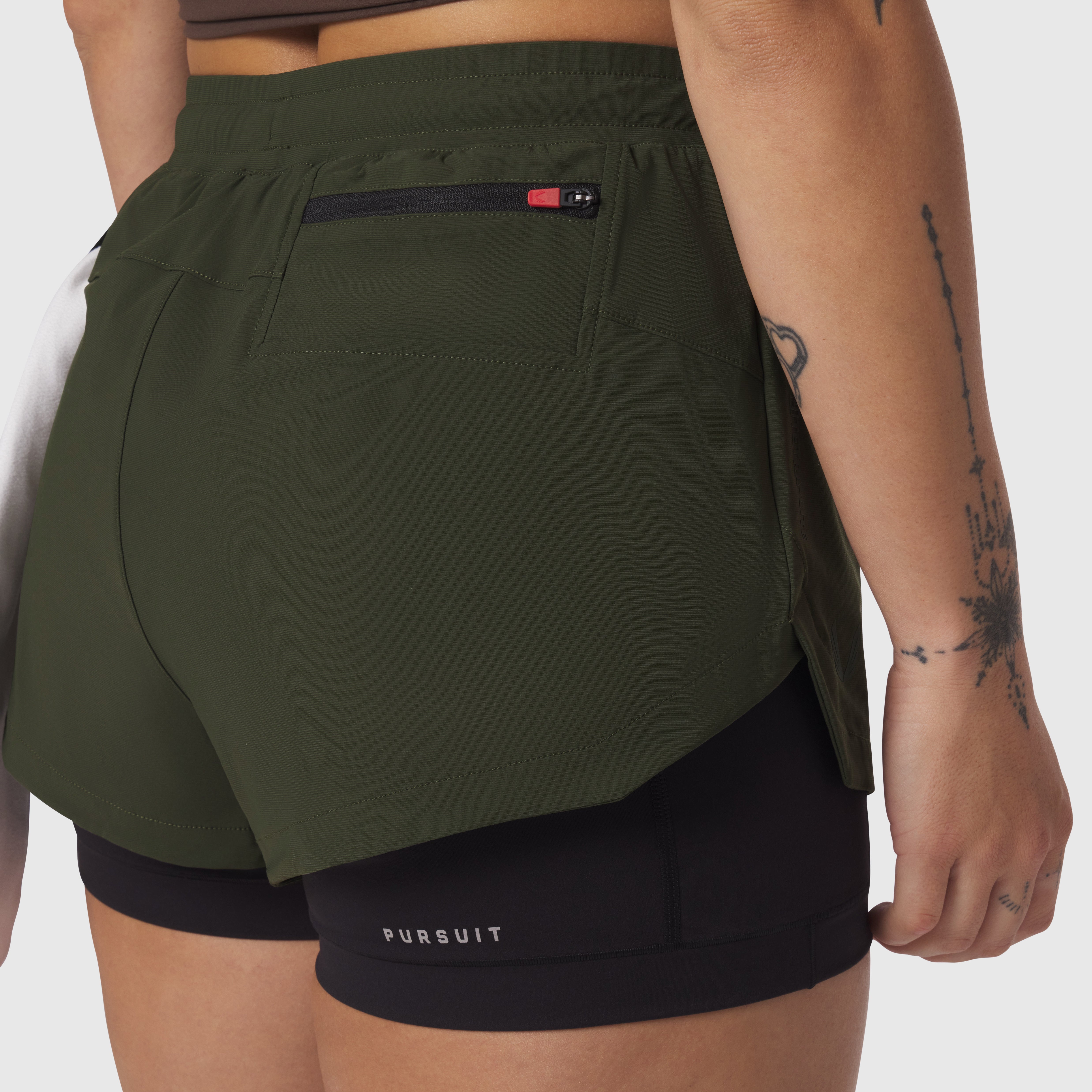 Tetra-Lite Liner Short in olive worn by model, back view showing pocket detail