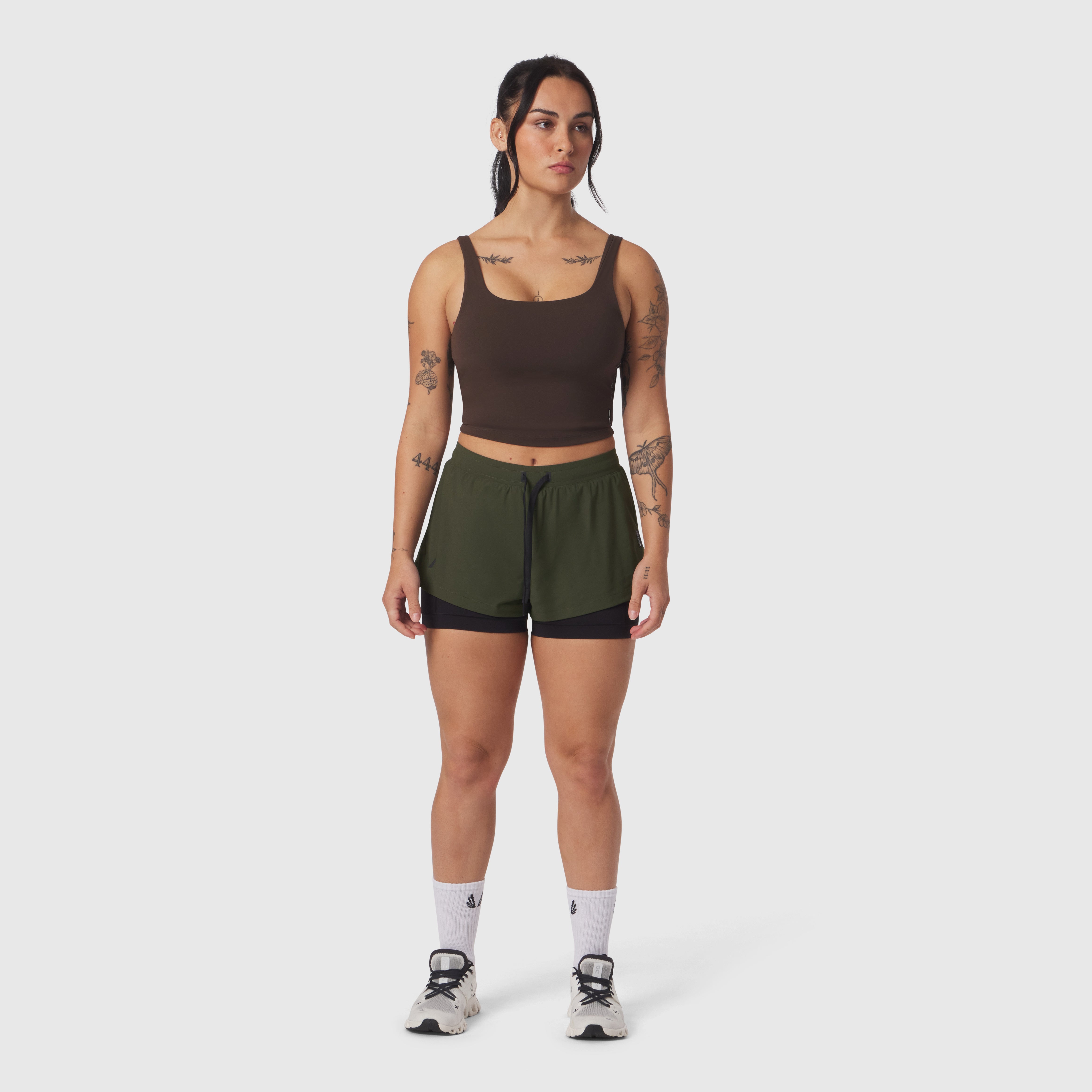 Tetra-Lite Liner Short in olive with black underlay, worn with brown crop tank top