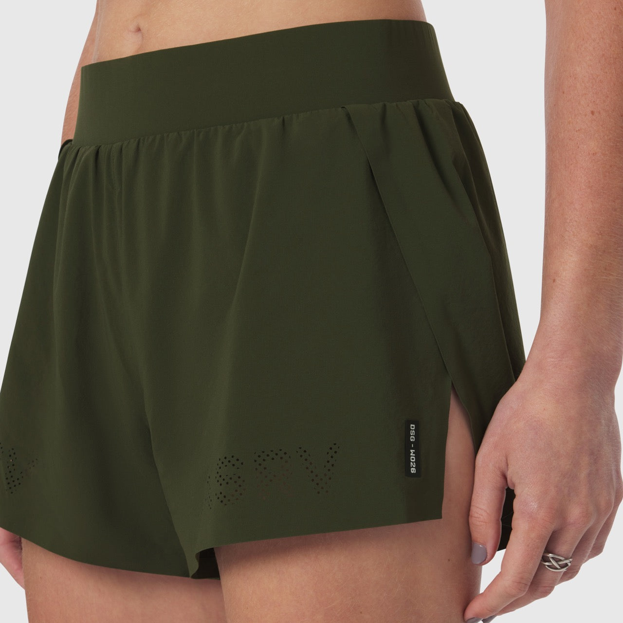Aerotex Side Split Run Short in olive, worn by model showing front view and side detail