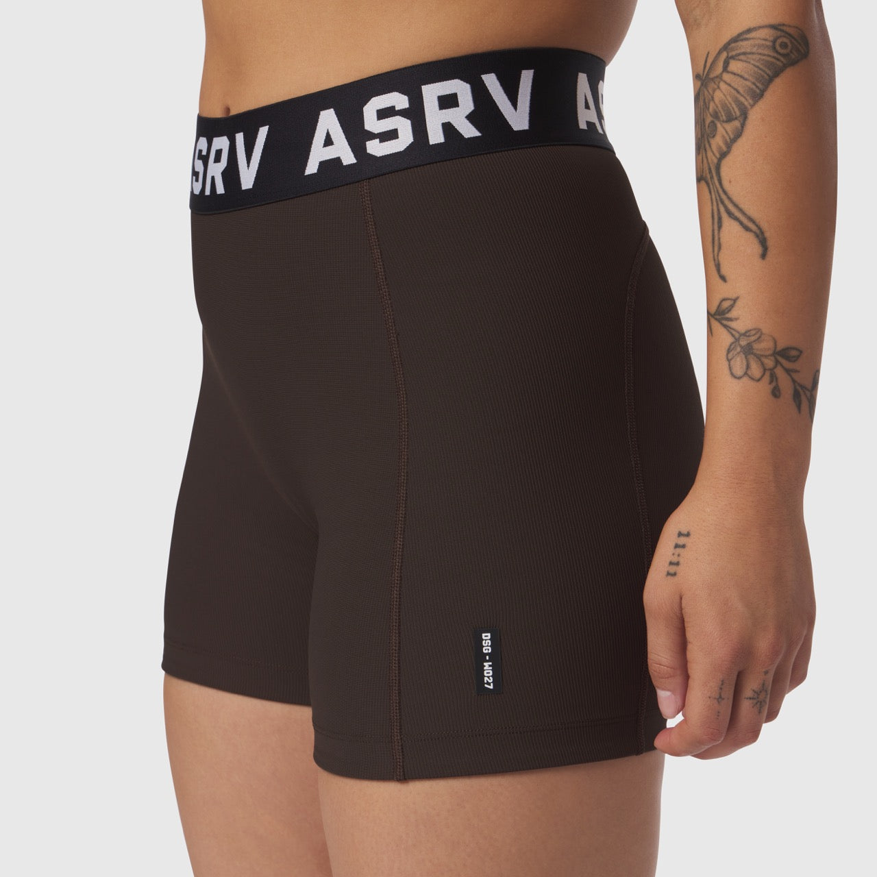 Lycra Ribbed Short in Dark Earth worn by model, side view showing waistband