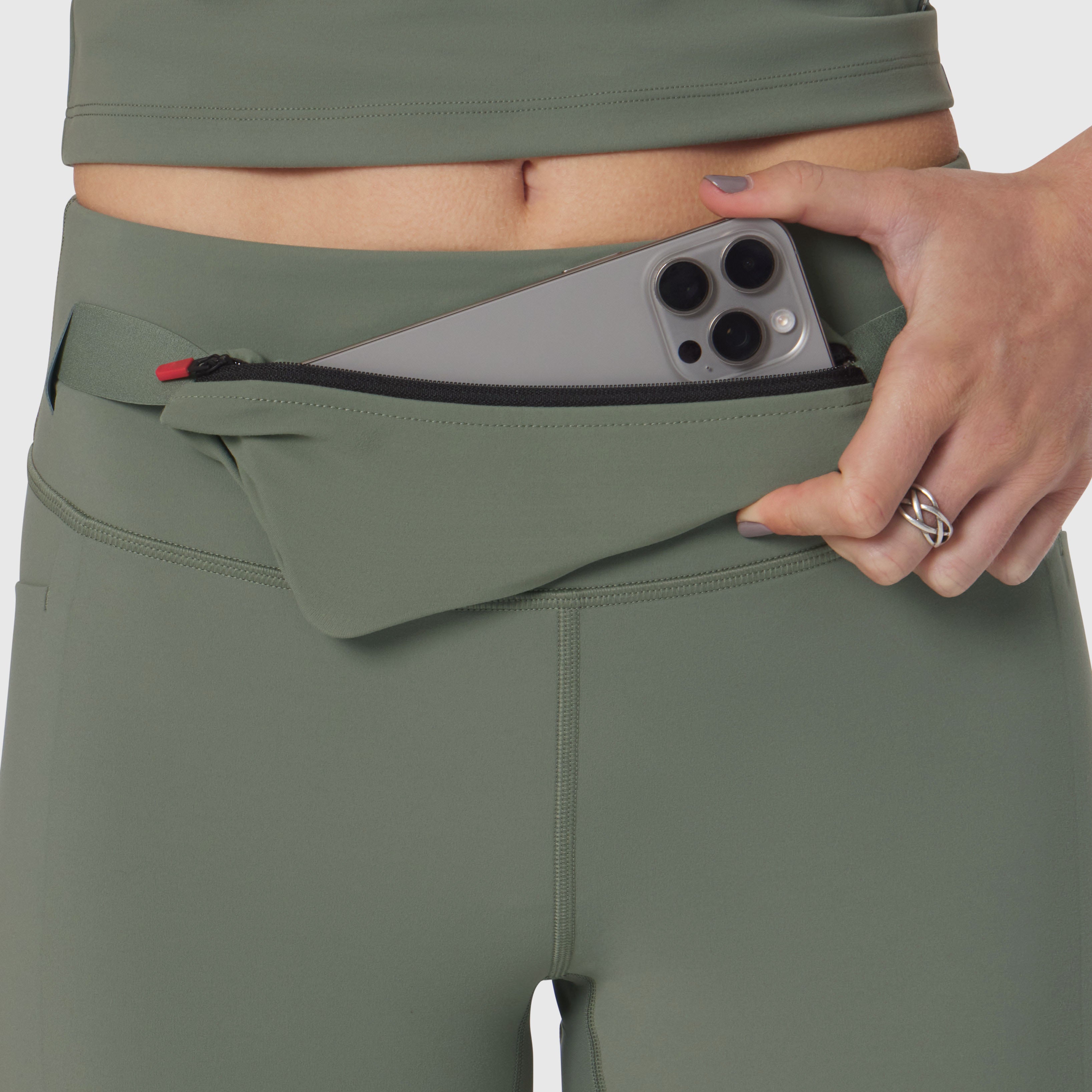 LYCRA® 3-in-1 Biker Short in sage worn by model, demonstrating phone pocket detail