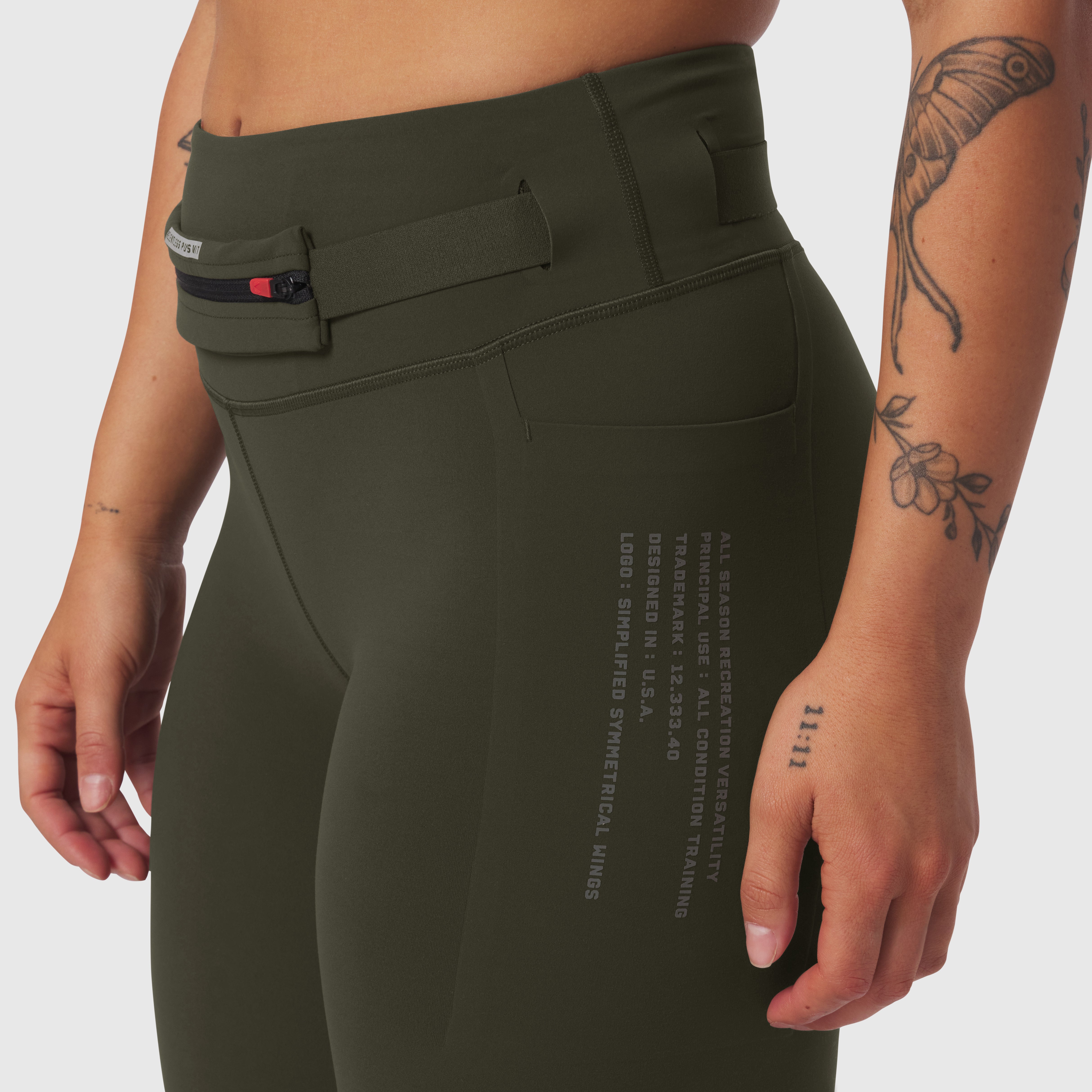 W030 LYCRA 3-in-1 Legging in olive worn by model, side view detail