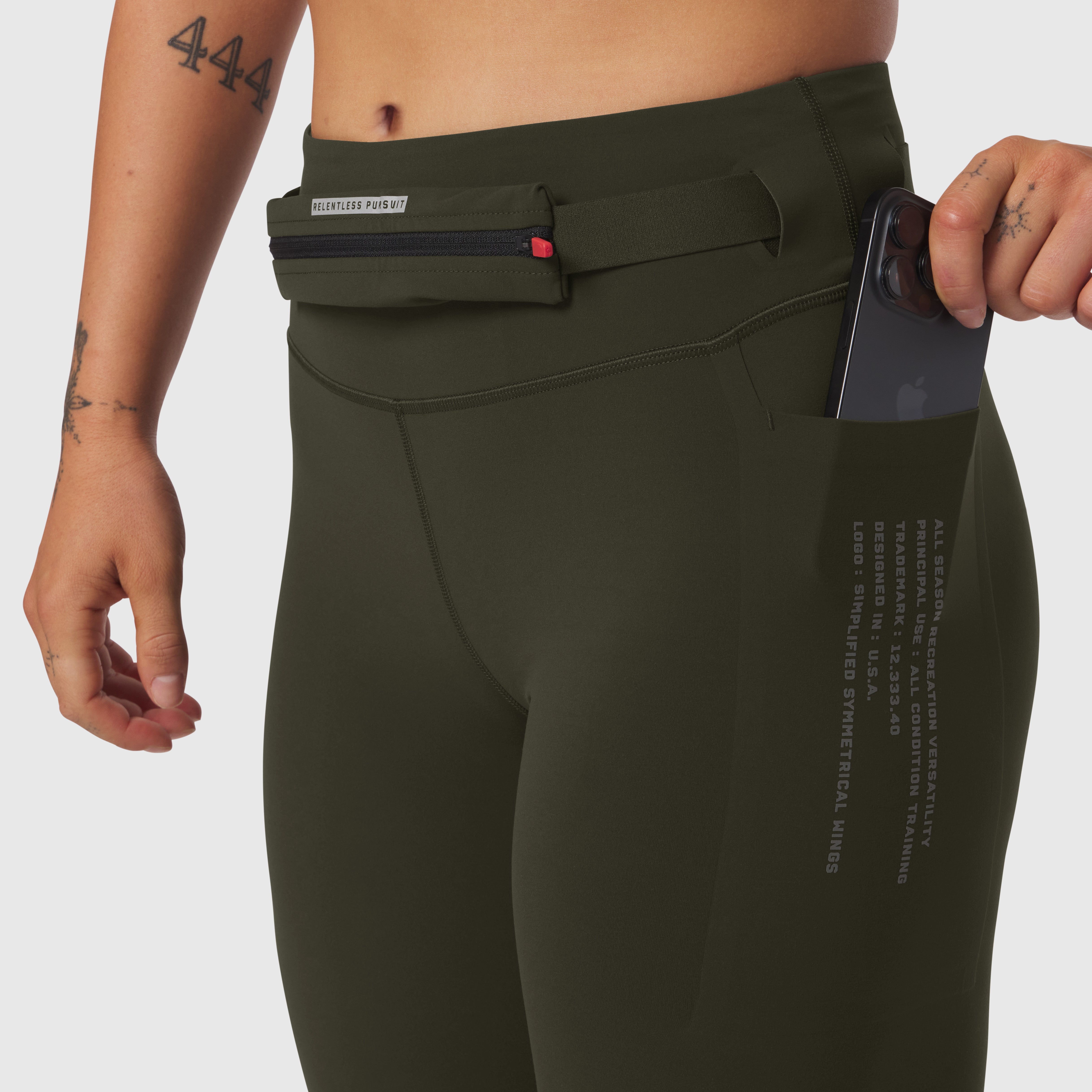 W030 LYCRA 3-in-1 Legging in olive, worn by model showing side pocket and waistband detail