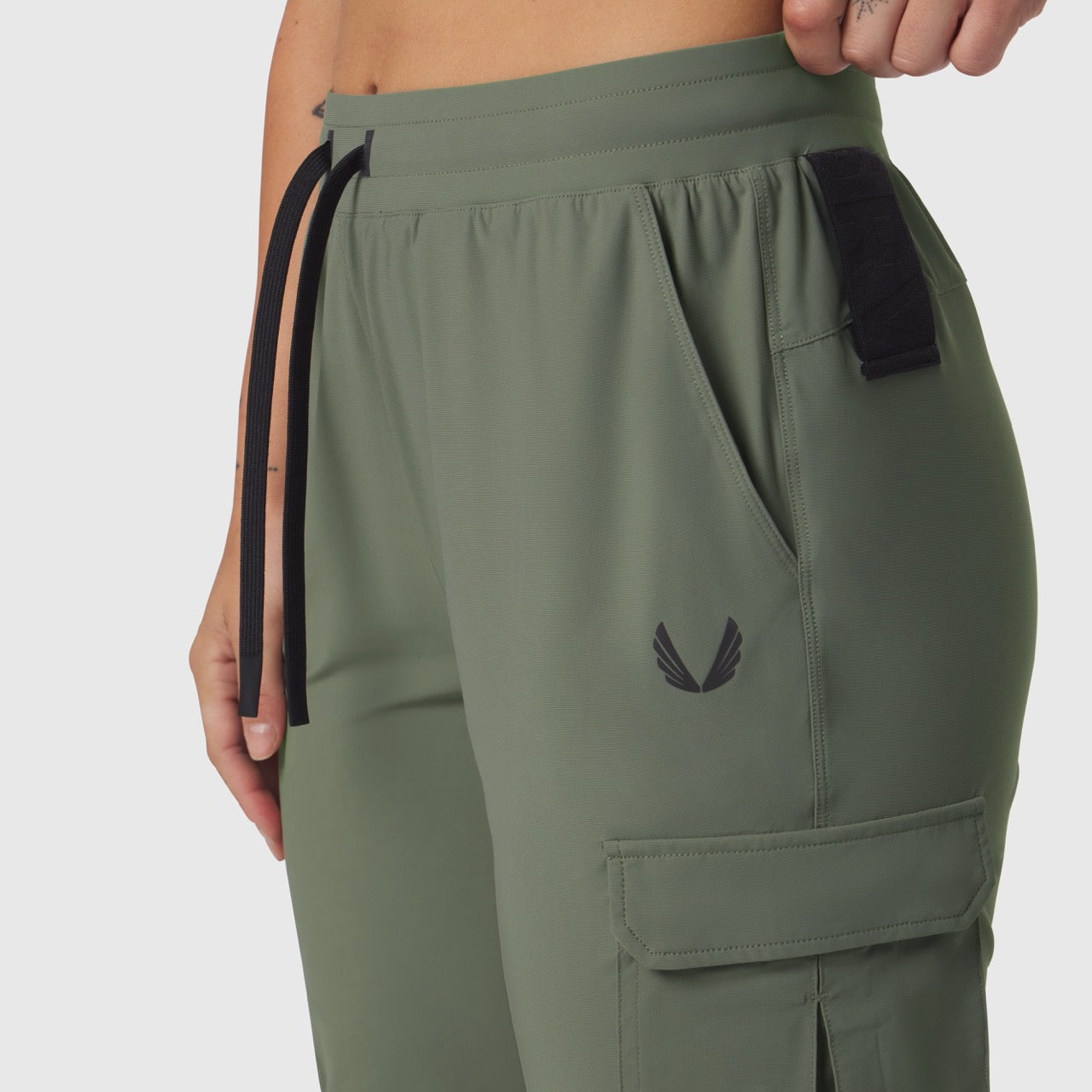 Tetra-Lite Cargo High Rib Jogger in sage worn by model, side view