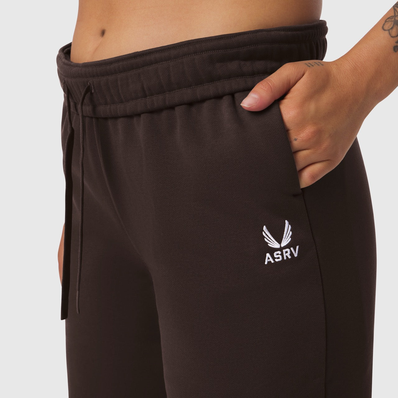W034 Sorona Terry Straight Leg Sweats in dark brown, worn by model showing front pocket detail