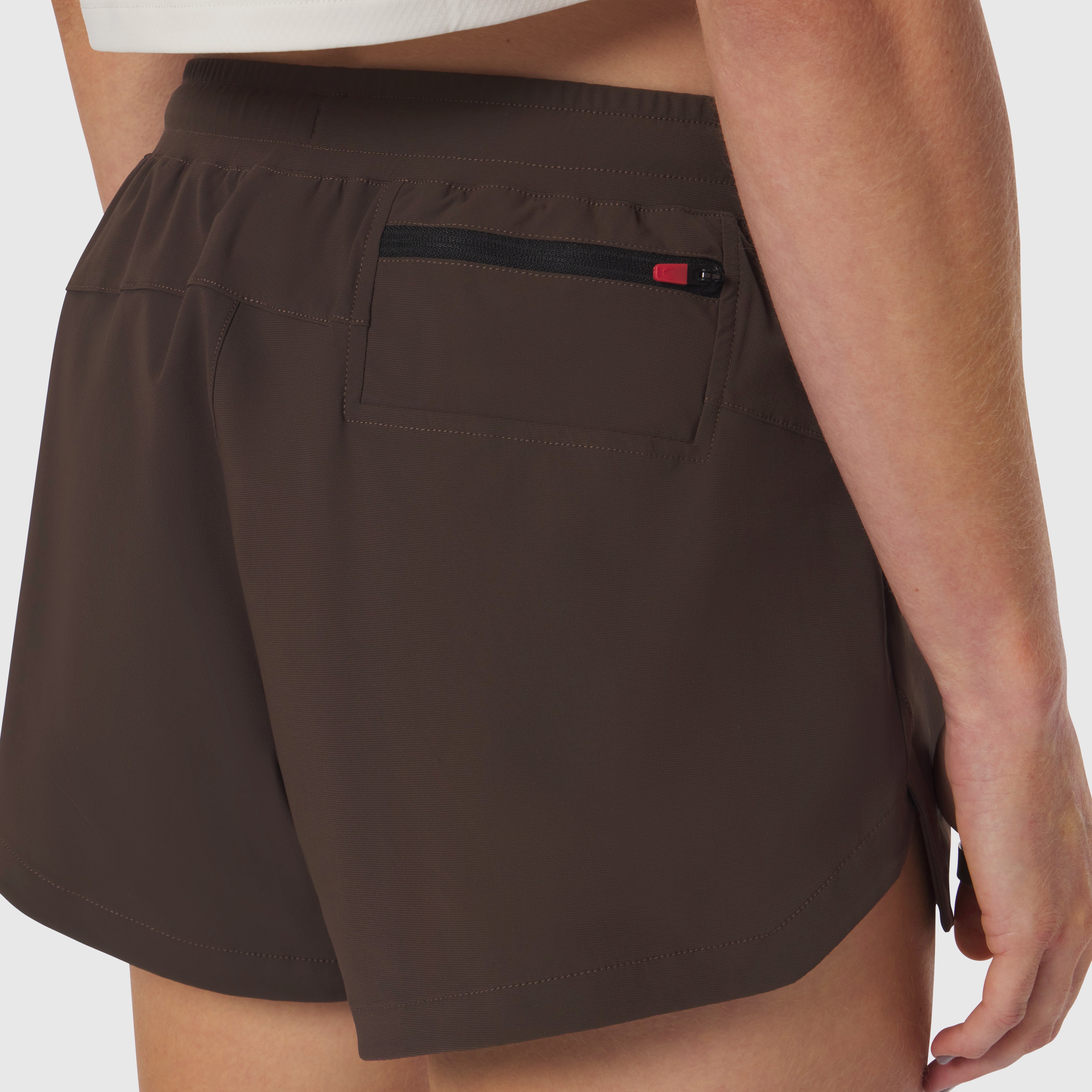 Tetra-Lite Linerless Short in Dark Earth, worn by model showing back pocket detail