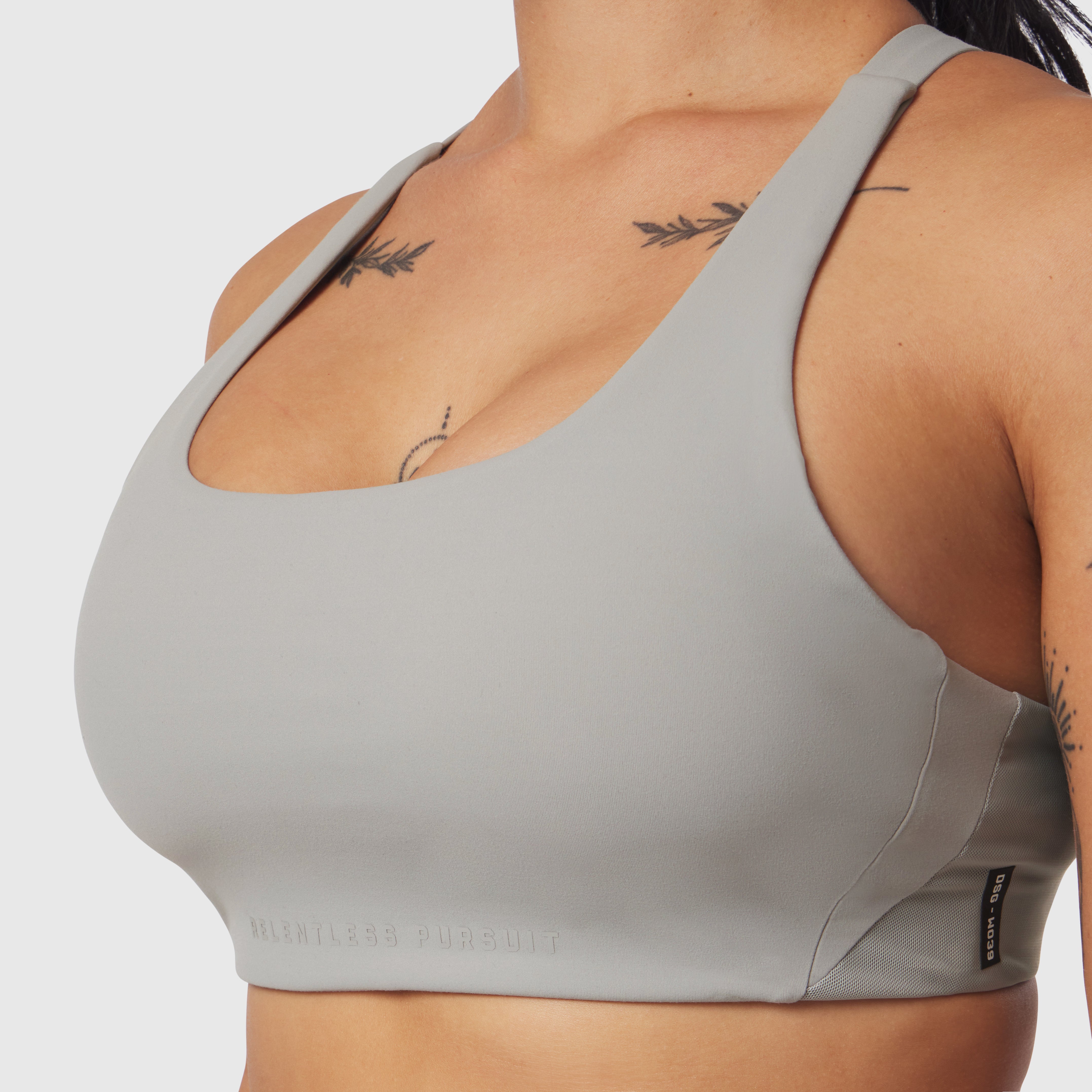 Lycra Hybrid Sports Bra in Slate Grey, worn by model showing front view and fit