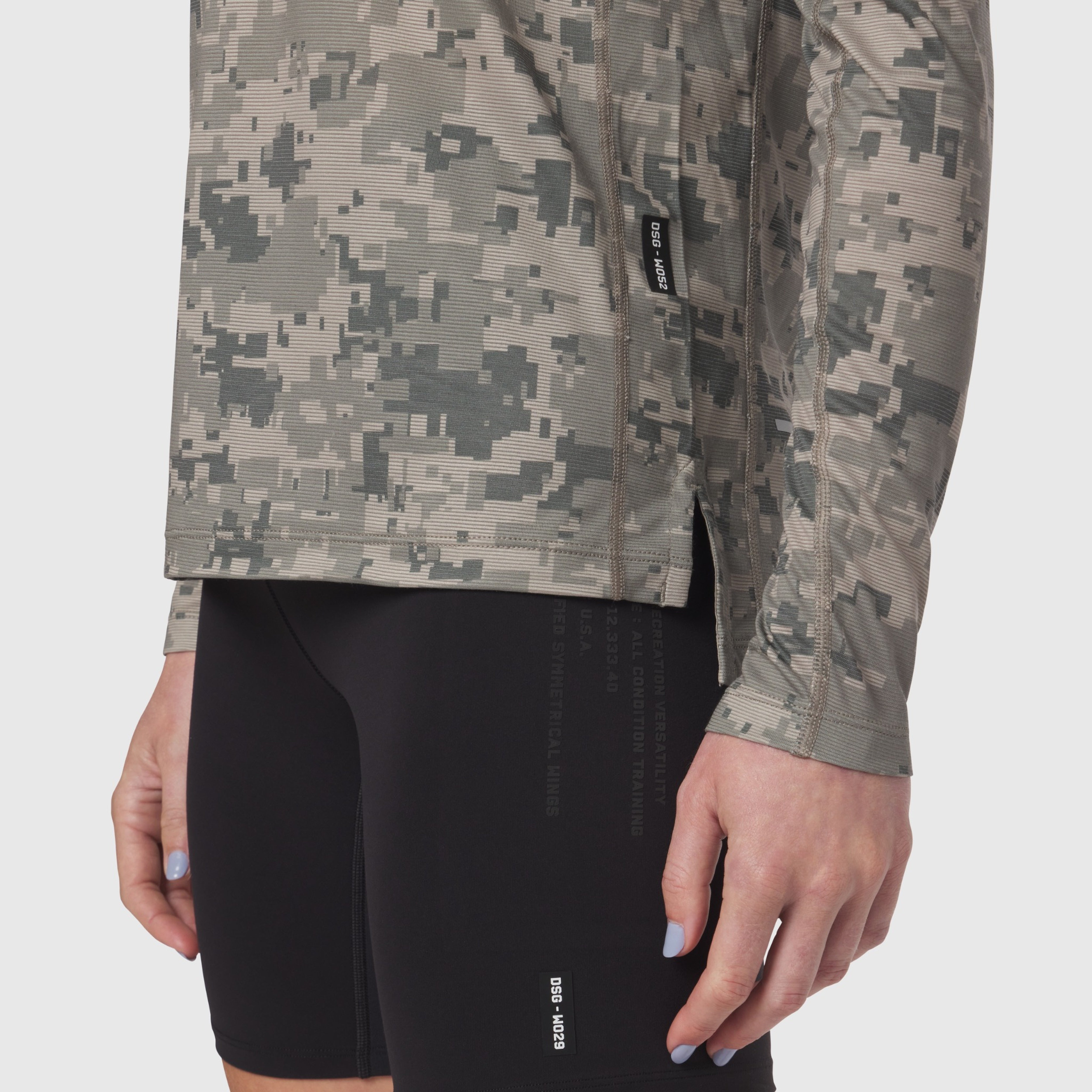 W052 Polartec® Delta Longsleeve in digital camo worn with black shorts, front detail view
