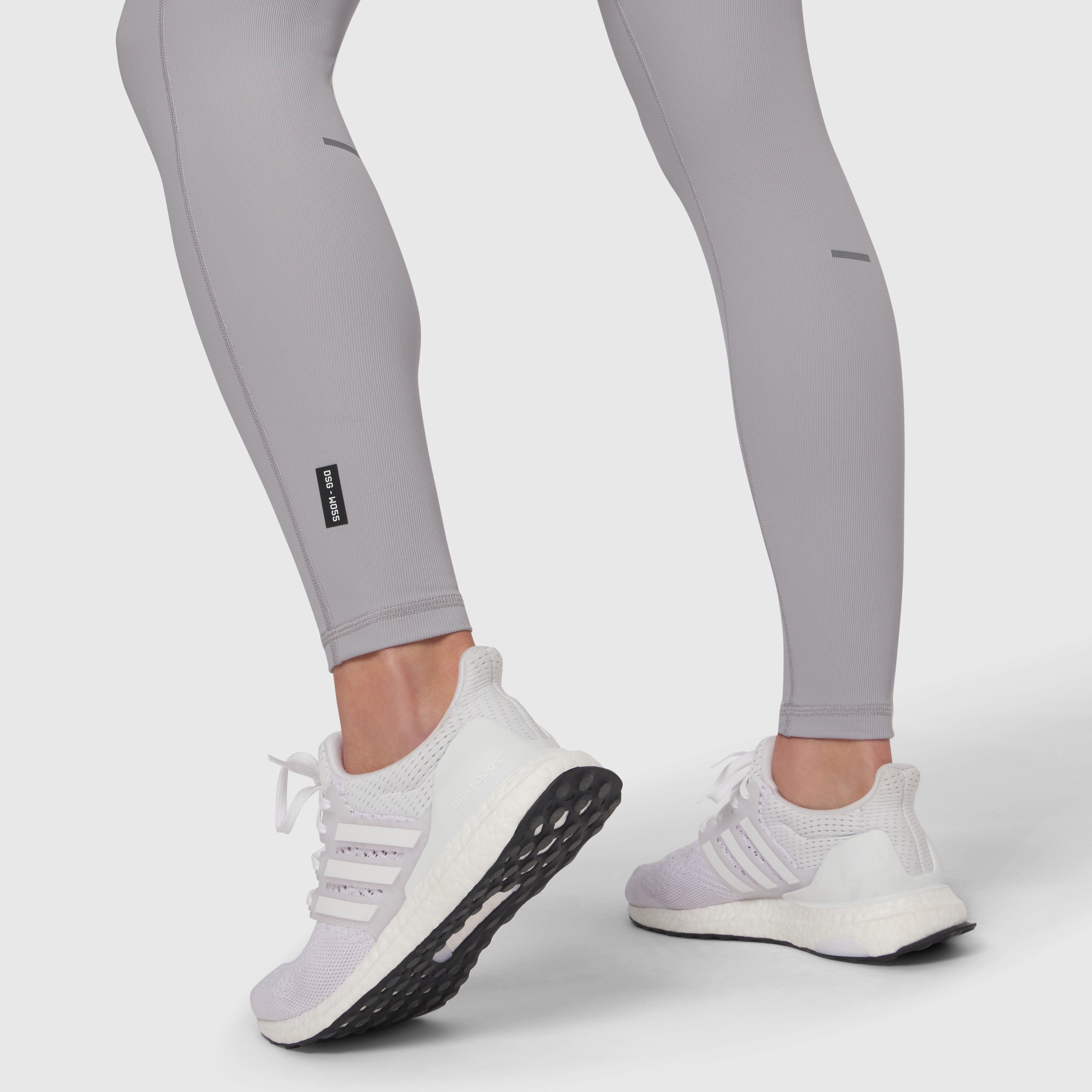 Lycra® Ribbed Running Tight in slate grey worn with white sneakers, lower body view