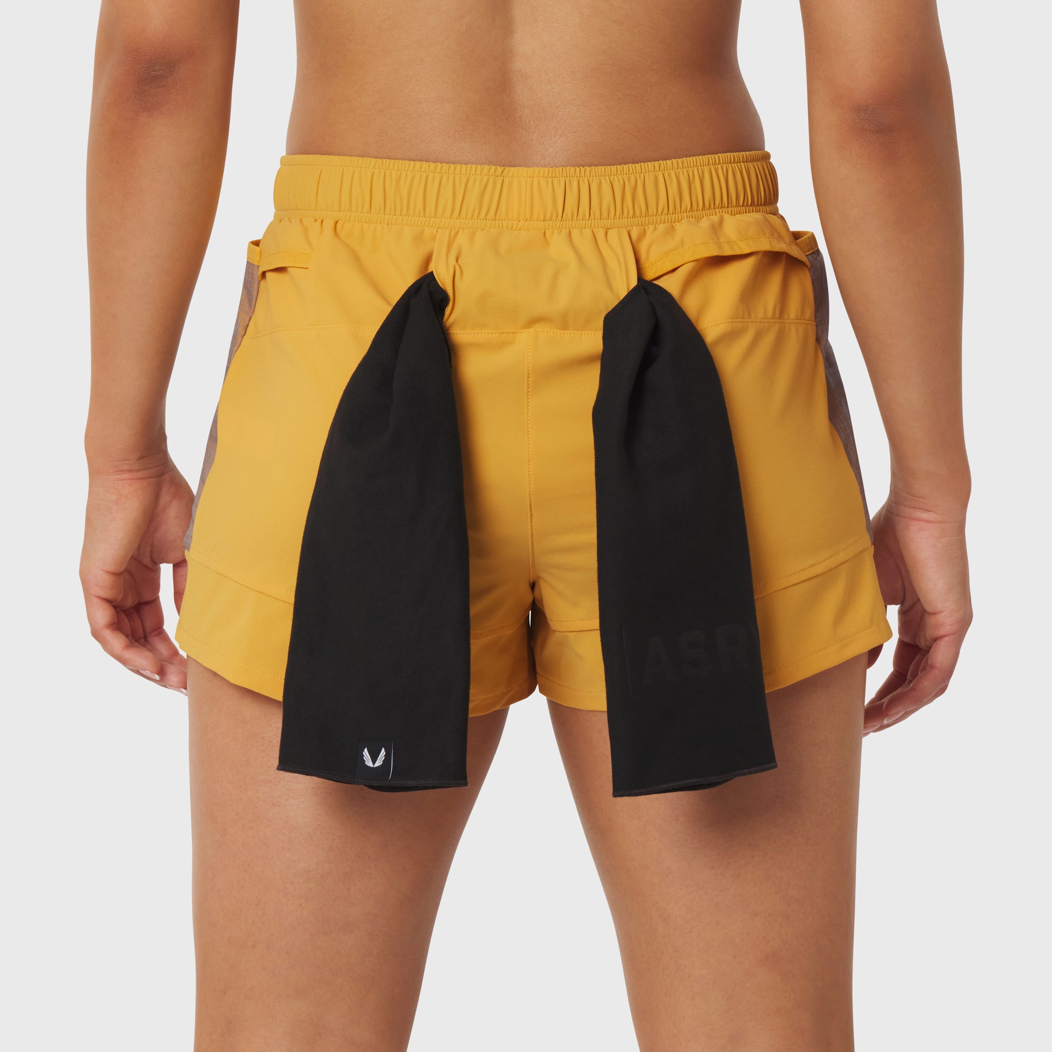Tetra-Lite Adventure Short in amber and black, worn by model, back view