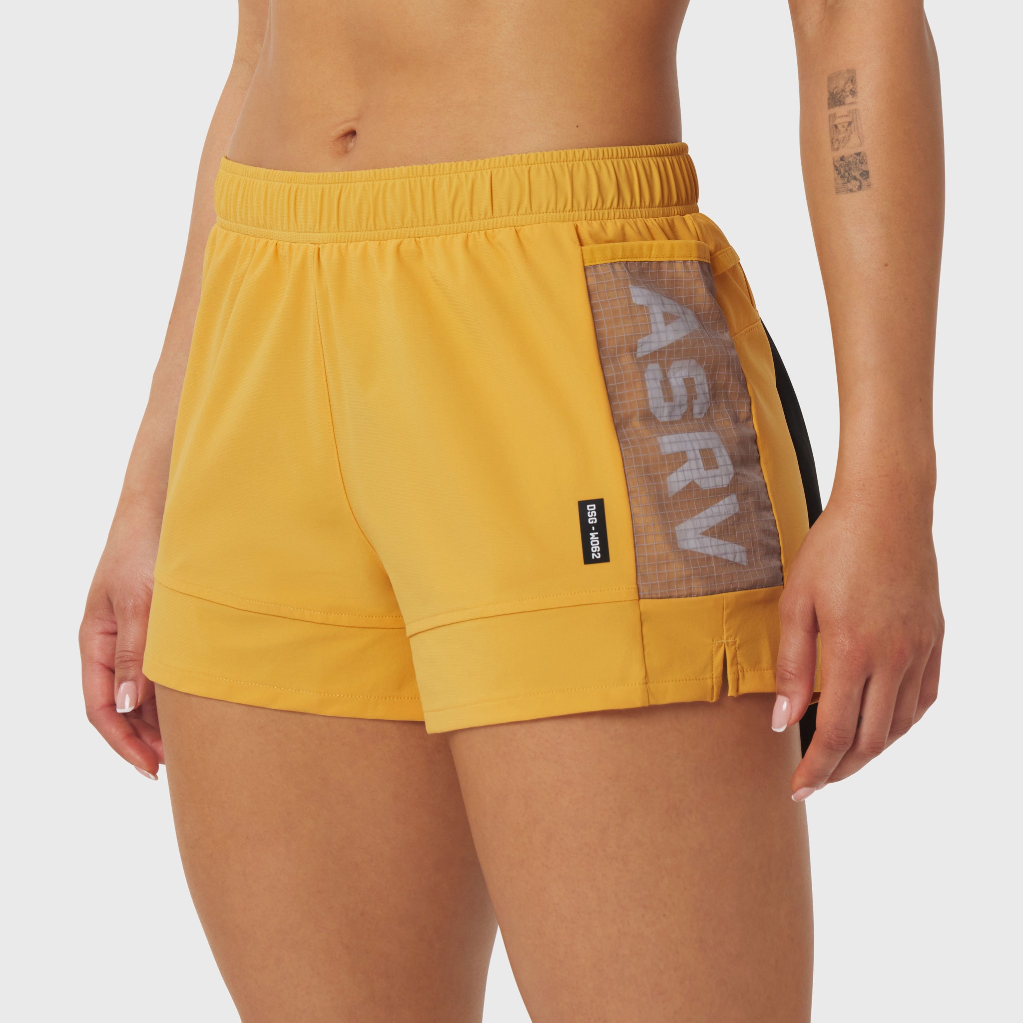 Tetra-Lite Adventure Short in amber yellow, worn by model, side view showing side panel detail