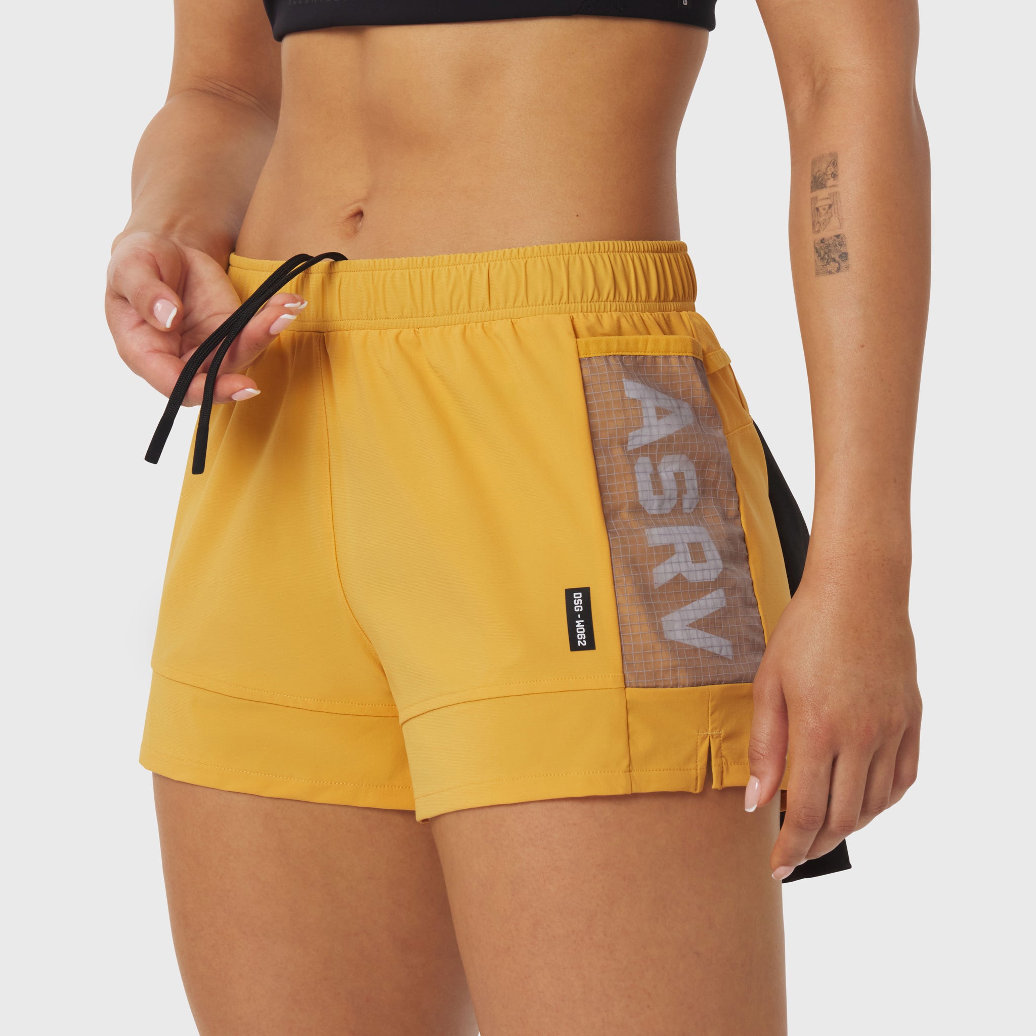 Tetra-Lite Adventure Short in amber yellow worn by model, side view