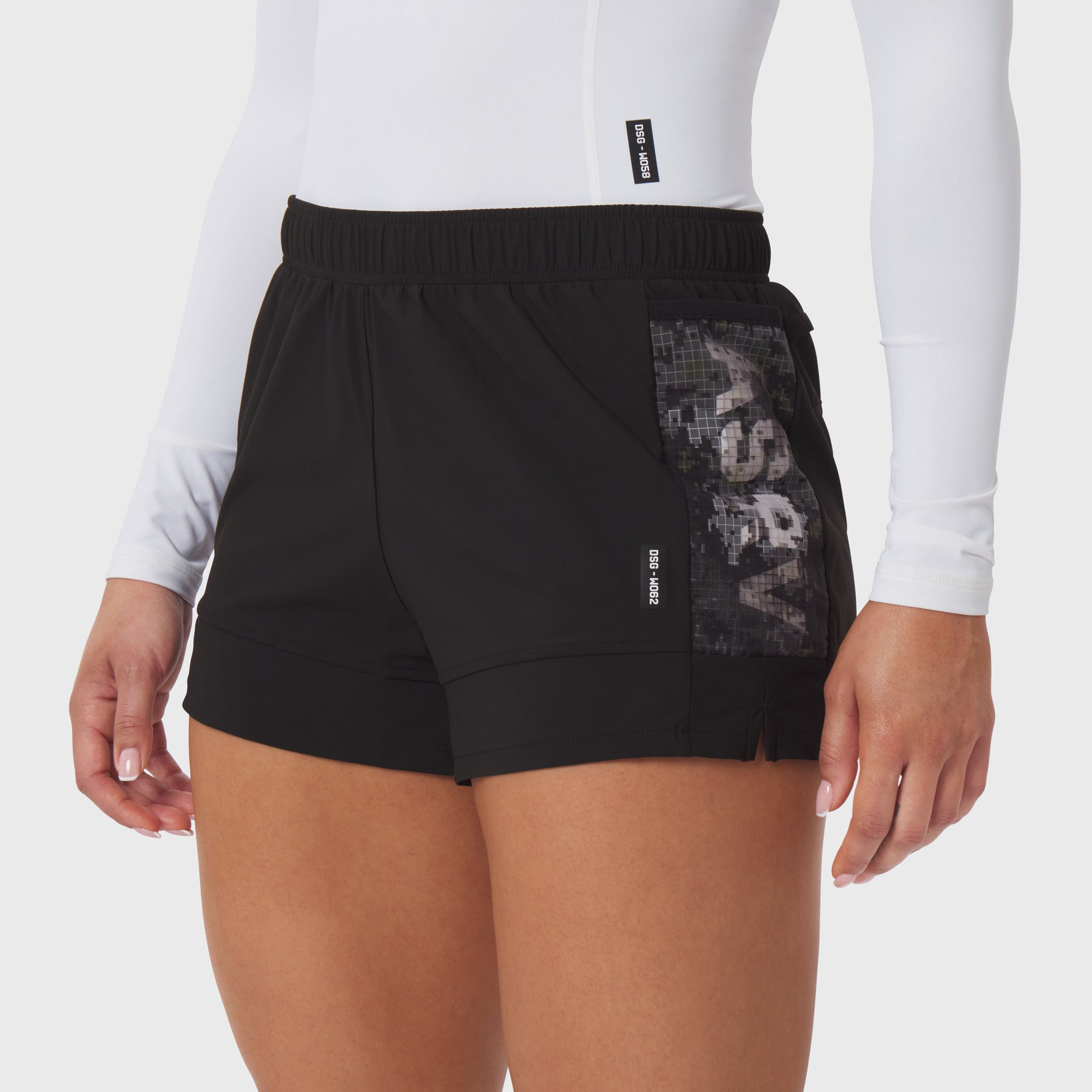 Tetra-Lite Adventure Short in black worn by model, front view showing mesh side panel detail