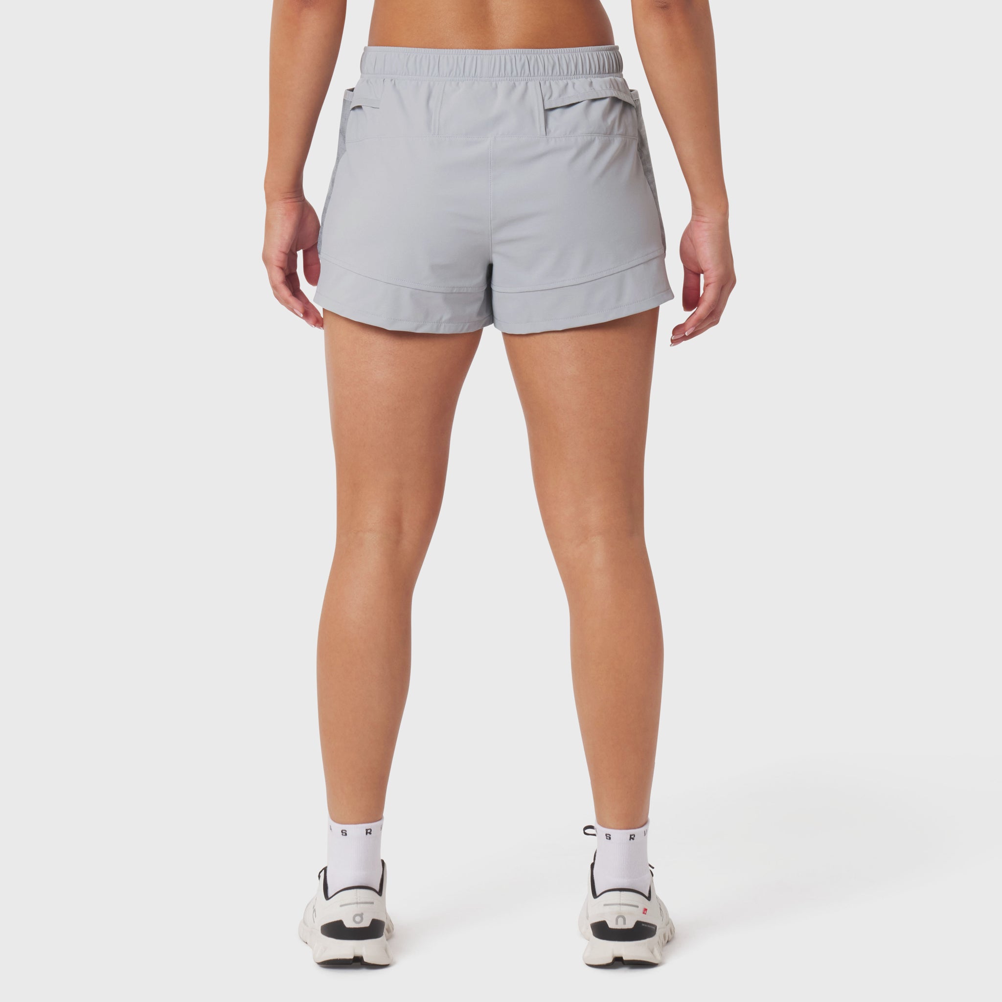 Tetra-Lite Adventure Short in slate grey, rear view on model with white sneakers