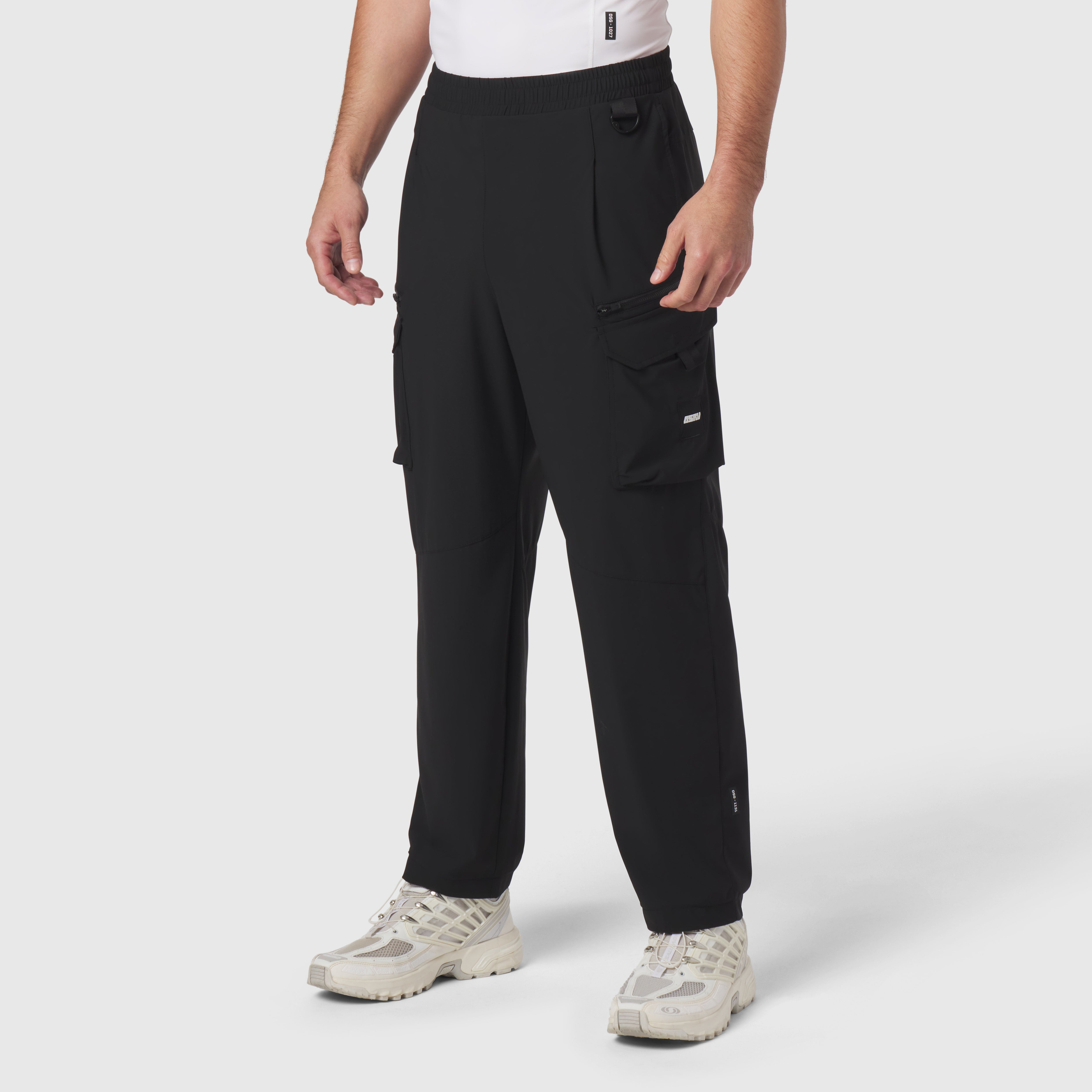 Tetra-Lite® Cargo City Pant in black worn by model, front view with hands in pockets