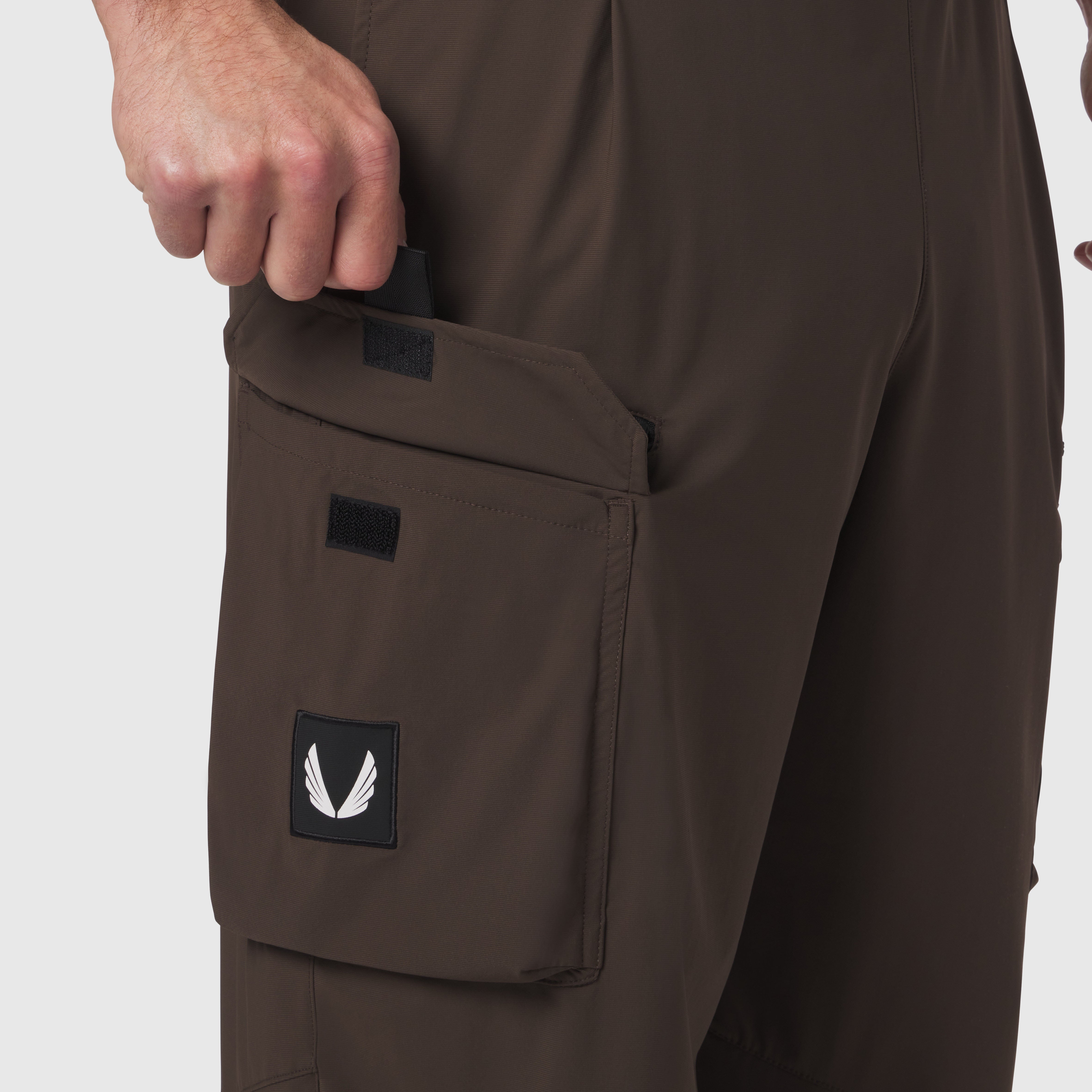 Tetra-Lite® Cargo City Pant in Dark Earth, model wearing pants with hand in cargo pocket