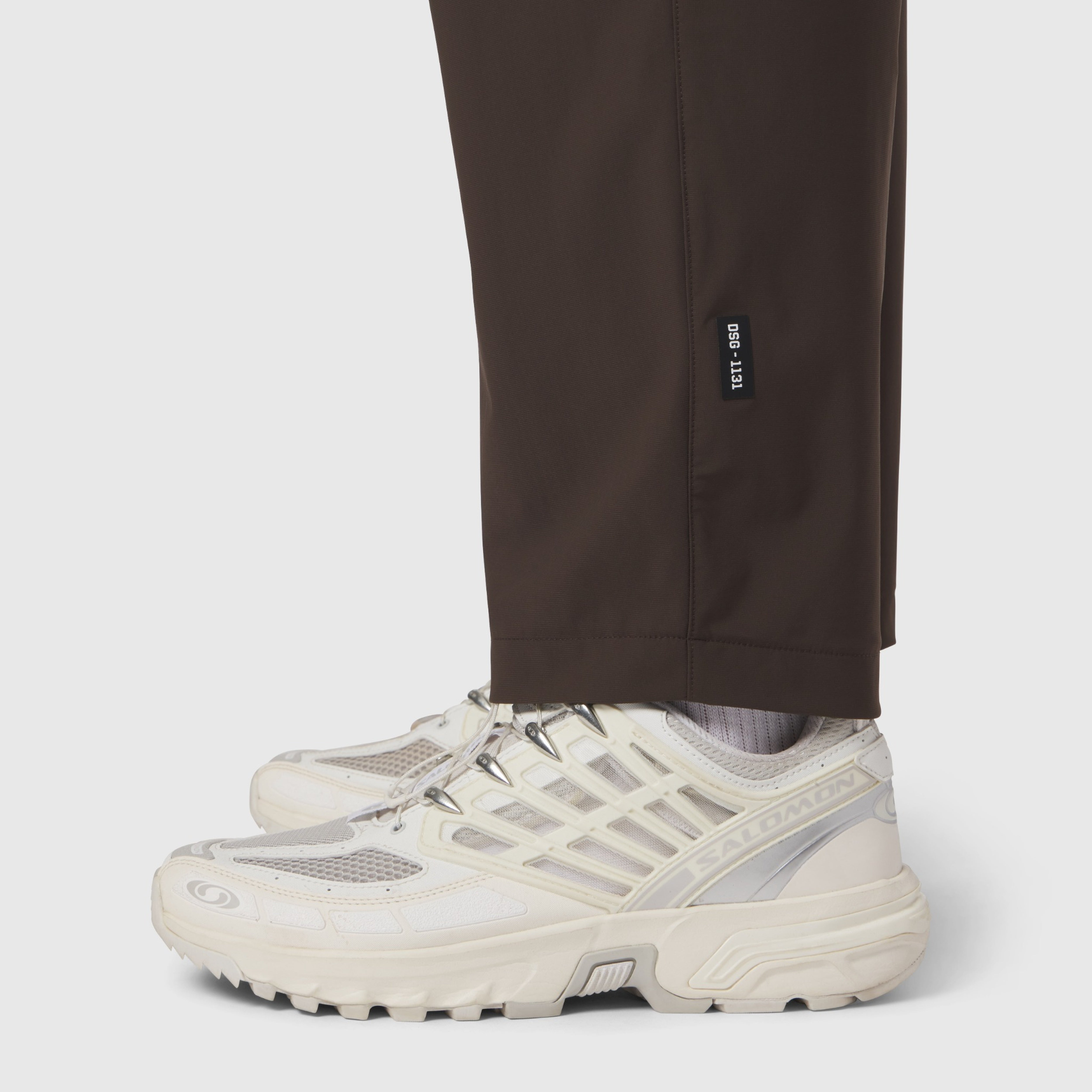 Tetra-Lite® Cargo City Pant in Dark Earth, worn with white sneakers, cropped view