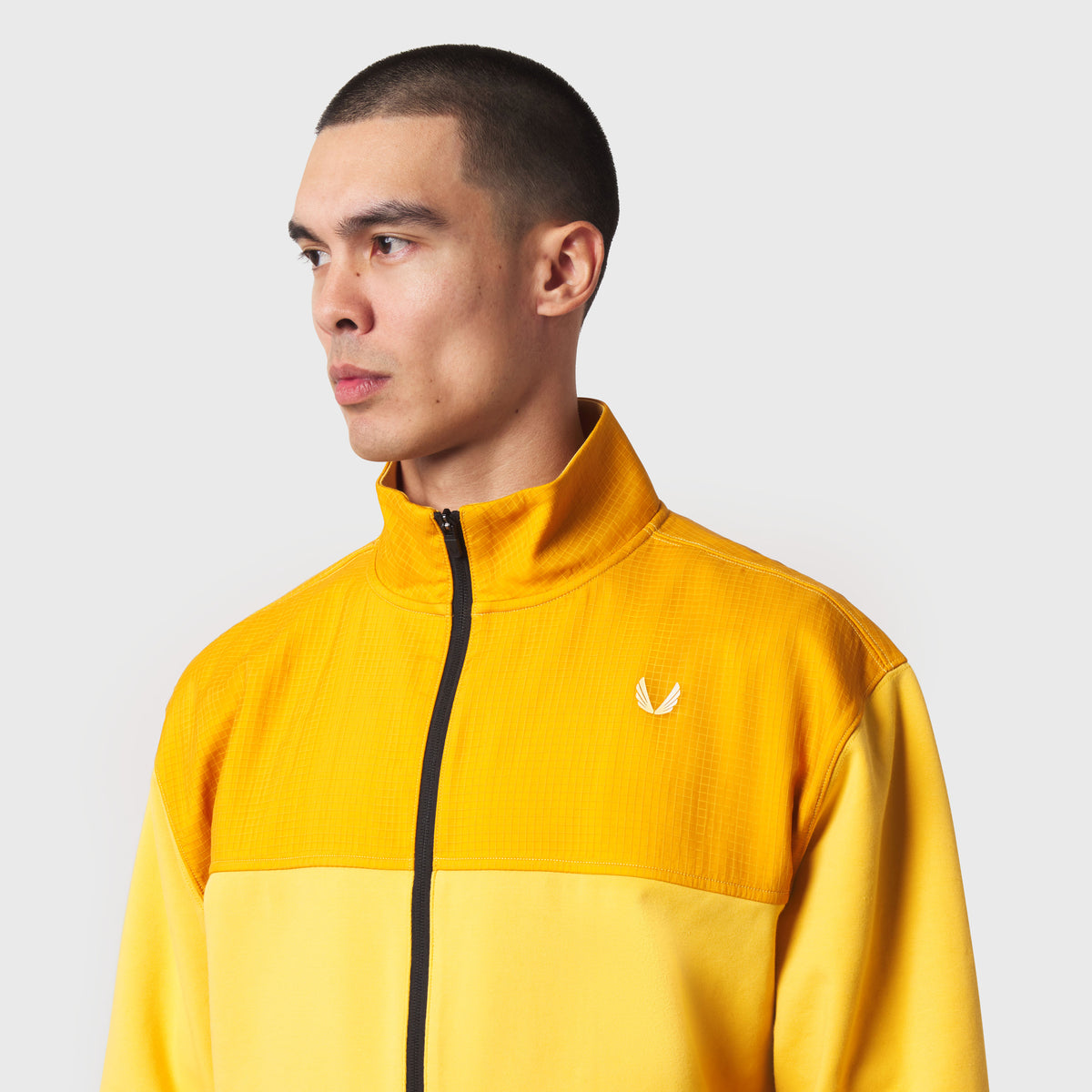 Dri-Core Sidelock Full Zip jacket in amber yellow, worn by model in profile view