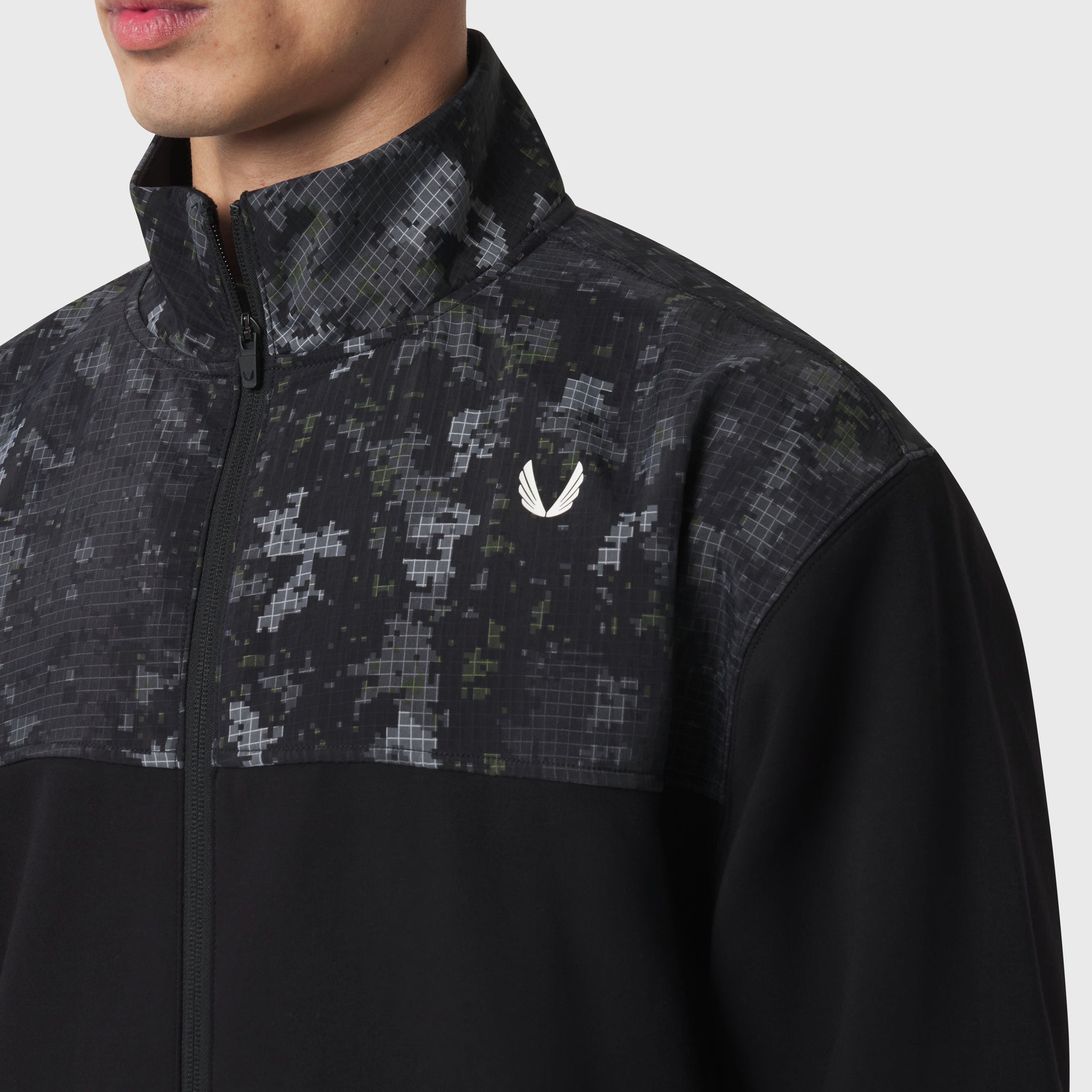 Dri-Core Sidelock Full Zip jacket in black with pixelated pattern panel, worn by model