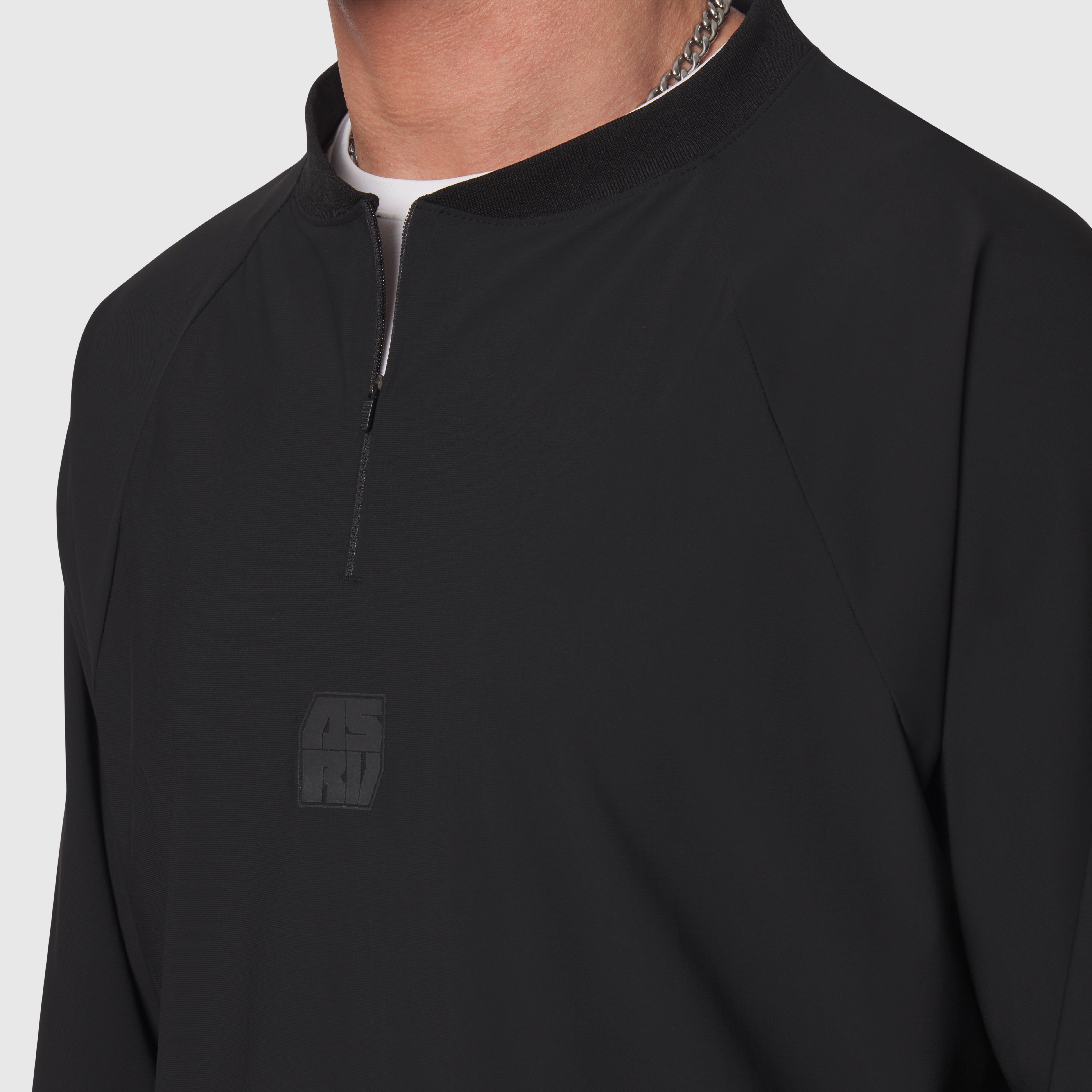 Tetra-Lite® Blade Collar Zip Jacket in black, worn with half-zip closure detail