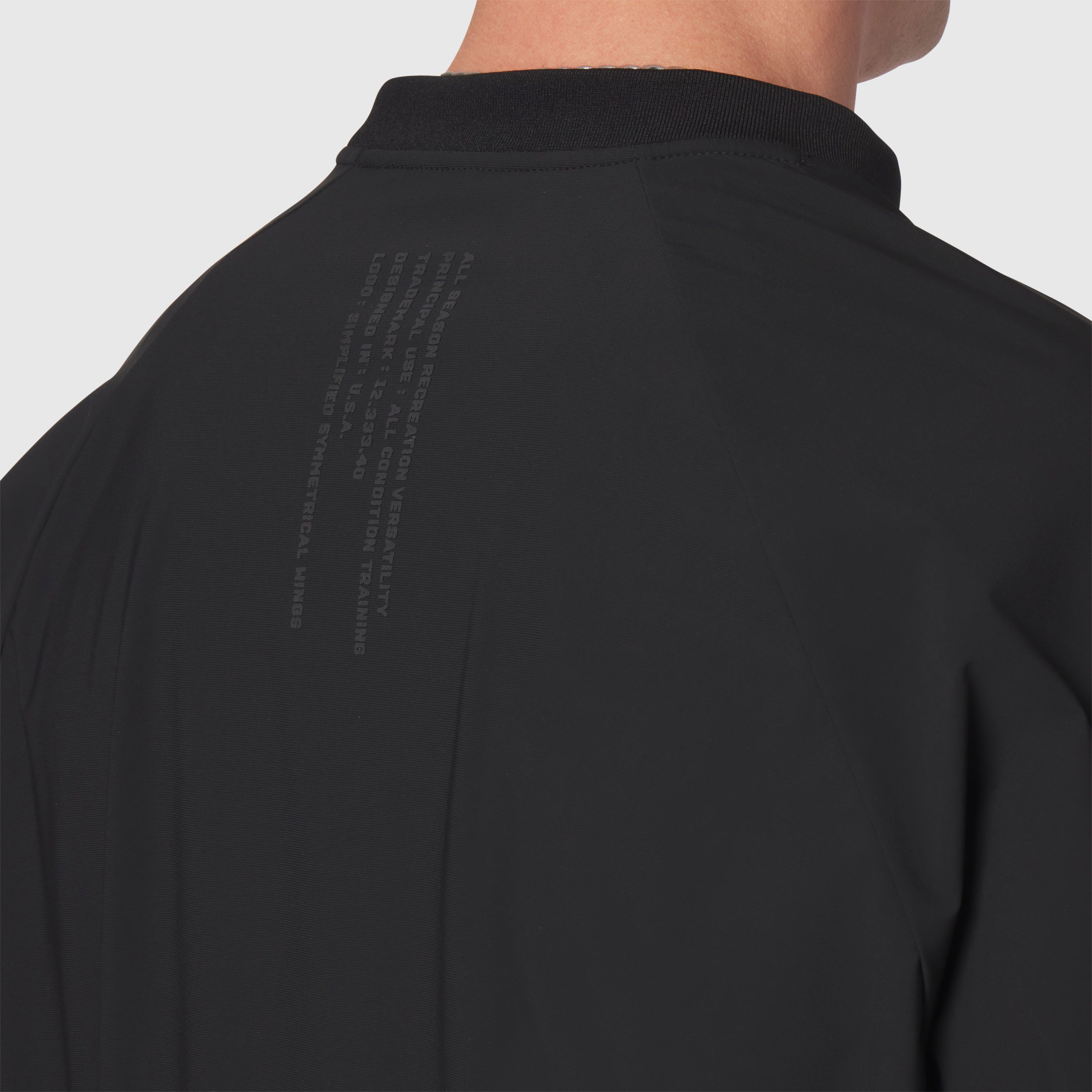 Tetra-Lite® Blade Collar Zip Jacket in black, back view on model