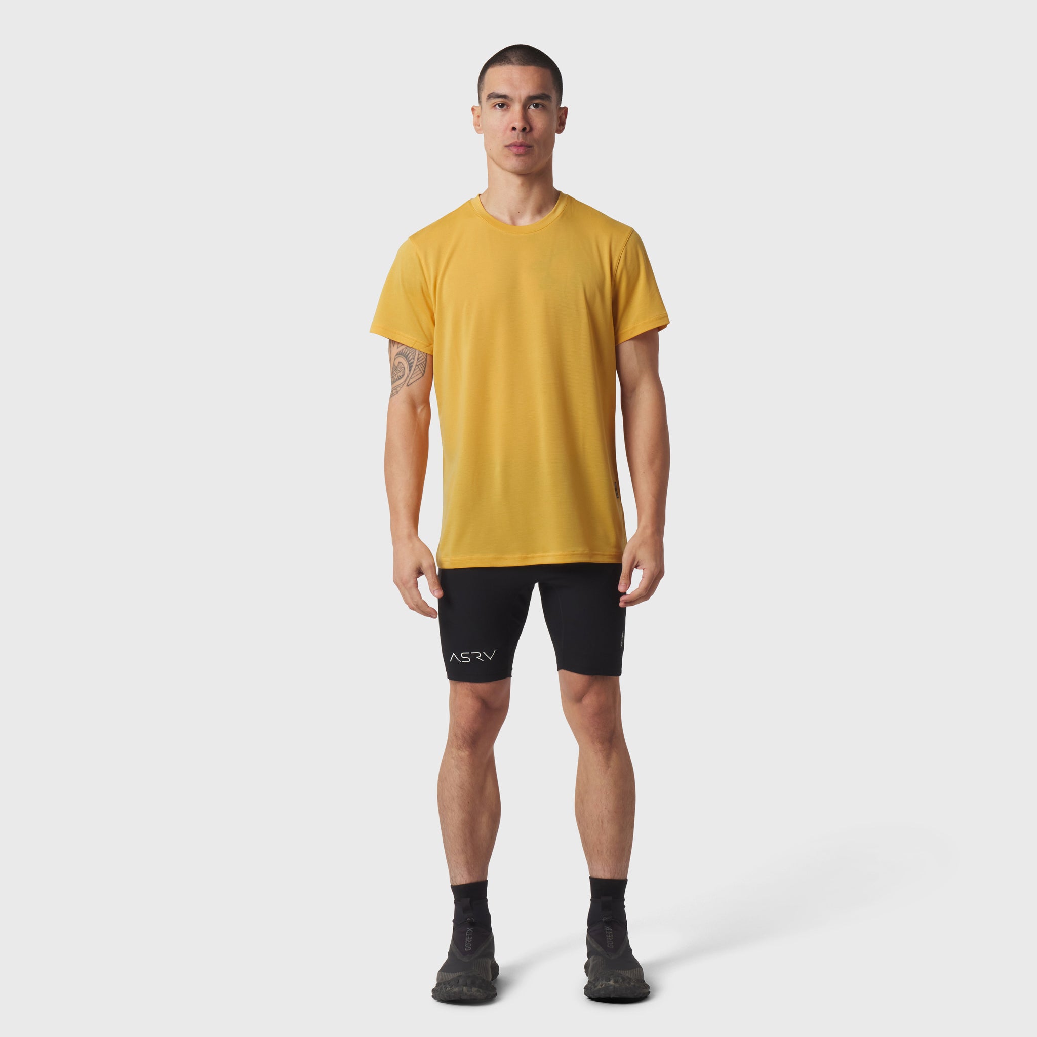 Polartec® Delta Training Tee in amber worn with black shorts, front view