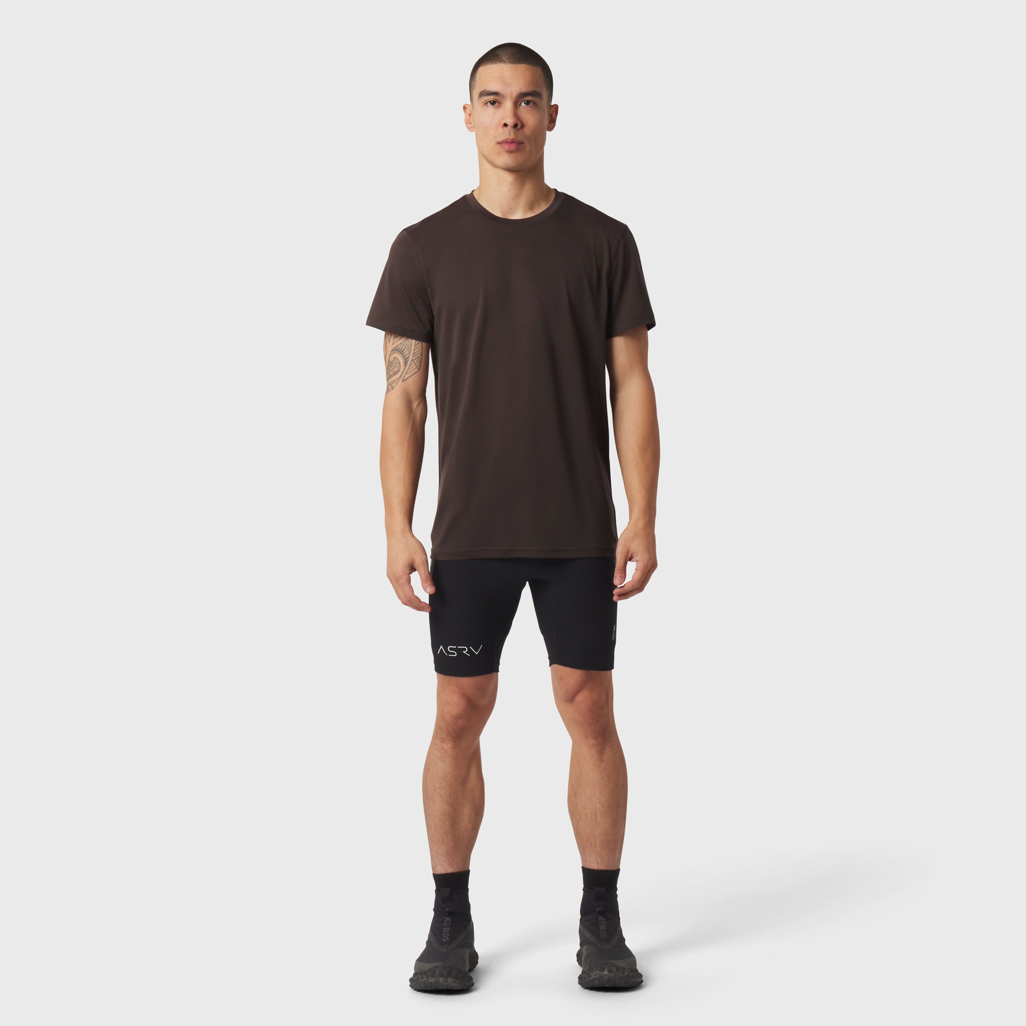 Polartec® Delta Training Tee in dark earth worn with black shorts, front view on model
