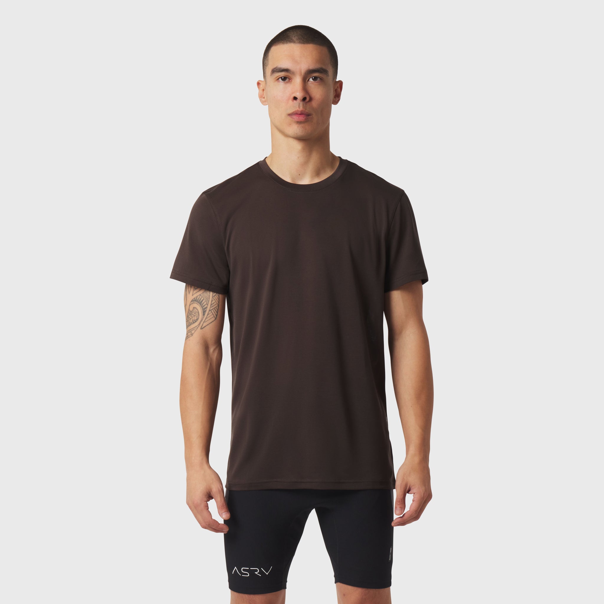 Polartec® Delta Training Tee in Dark Earth worn by model with black shorts, front view