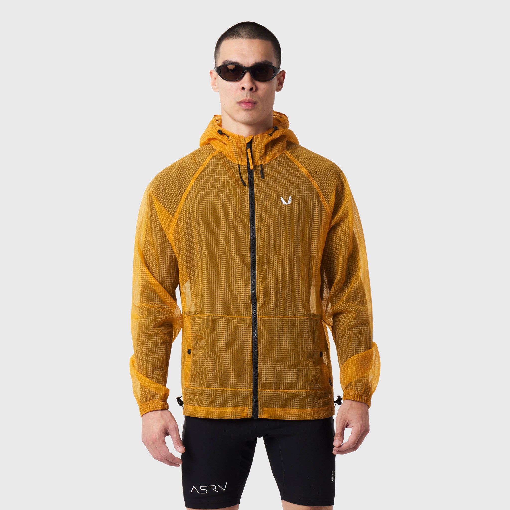 Weather-Ready Transparent Ripstop Shell Jacket in amber, worn by model with hood up, front view