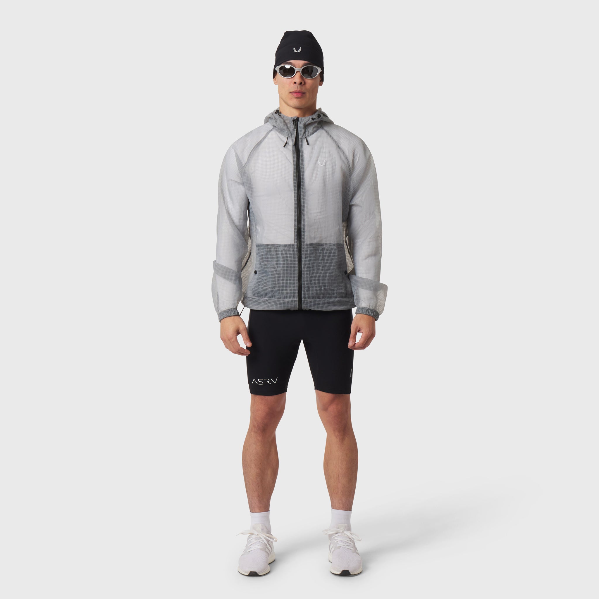 Weather-Ready Transparent Ripstop Shell Jacket in slate grey, worn by model with black shorts, front view