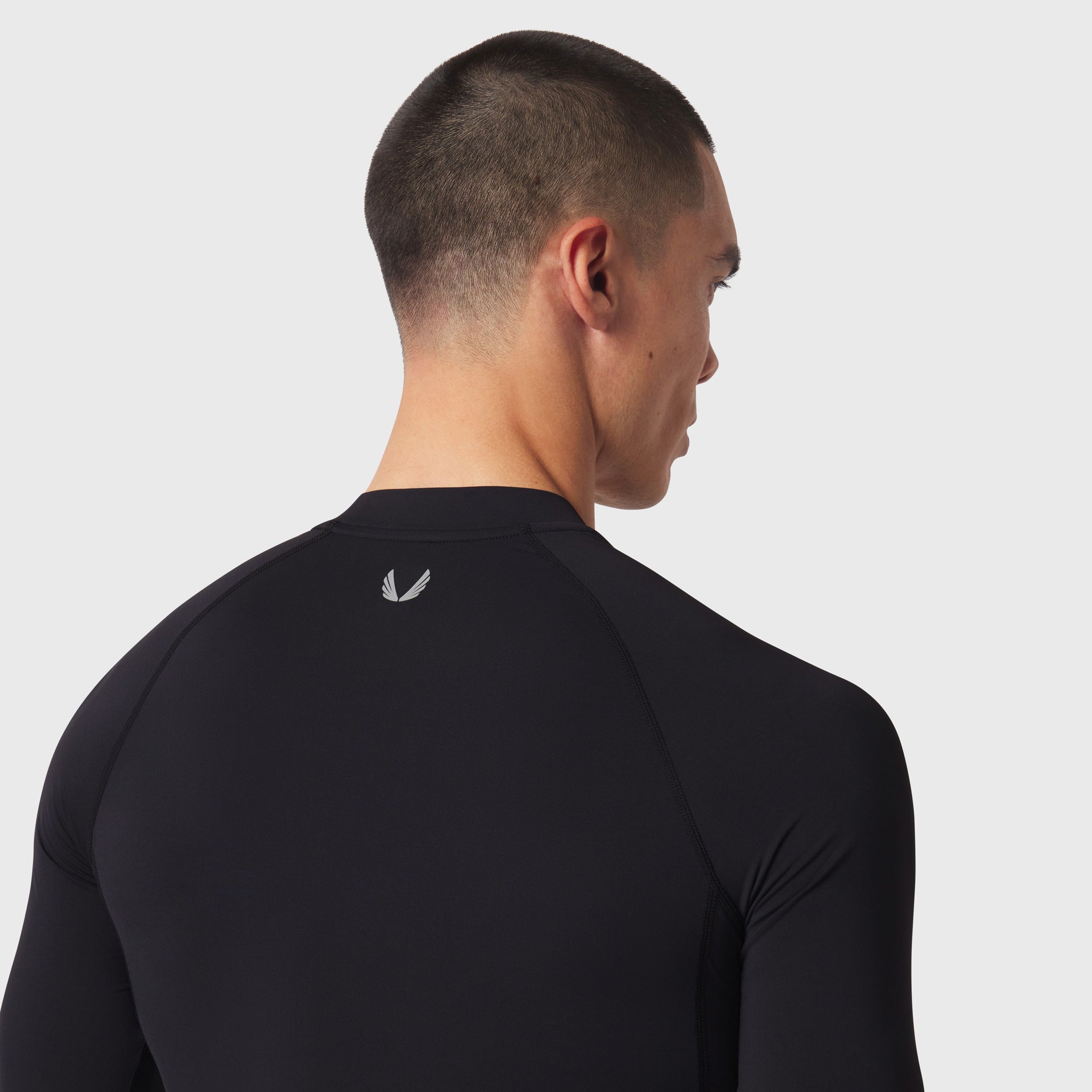 LYCRA® ADAPTIV Baselayer Longsleeve in black, back view on model