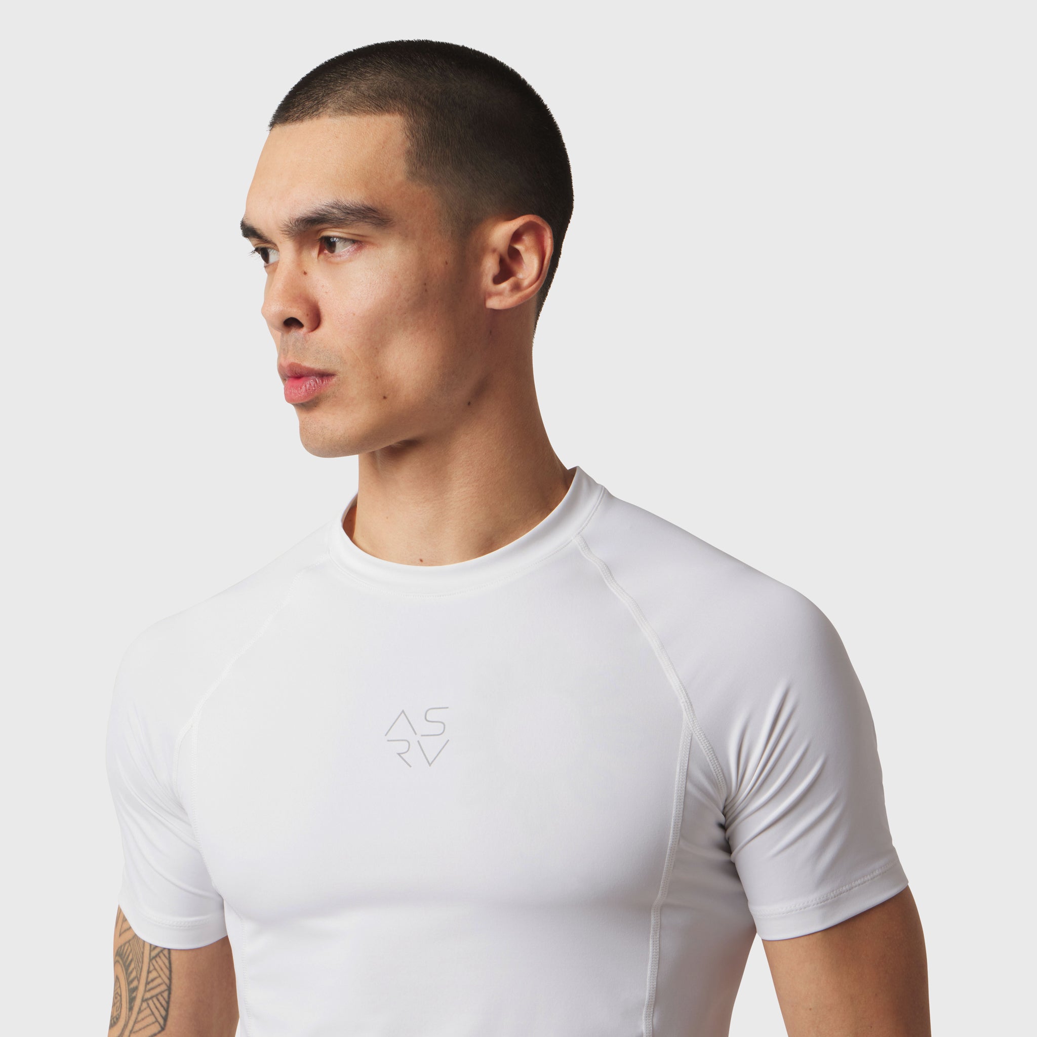 White LYCRA® ADAPTIV baselayer short sleeve t-shirt on model, side profile view