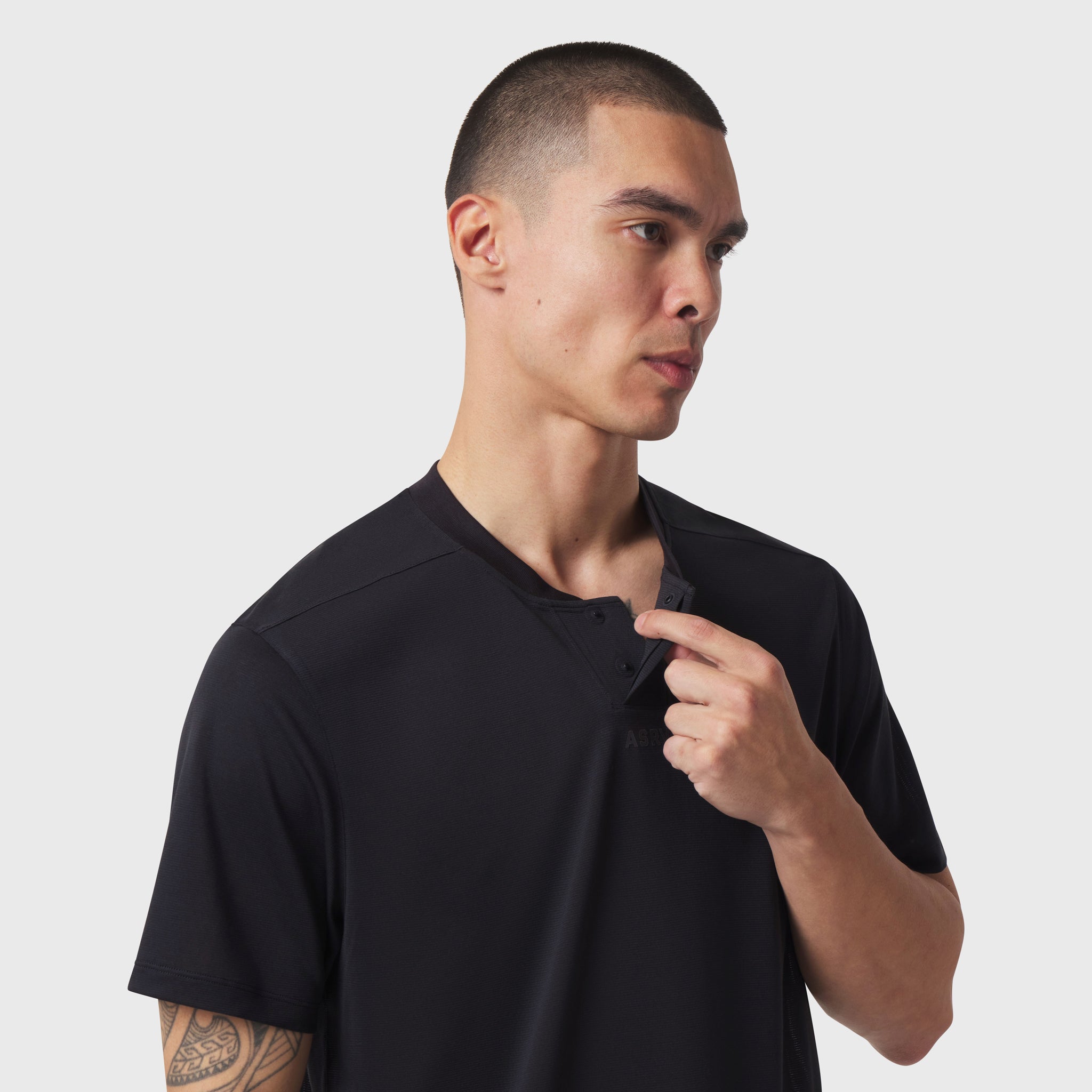 Black Polartec® Delta Polo worn by model, three-quarter view