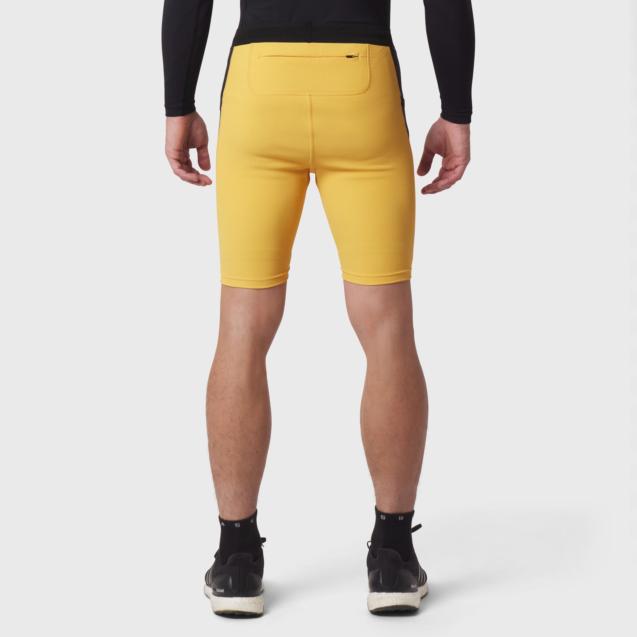 Lycra Ribbed Run Half-Tight in amber yellow, back view on model