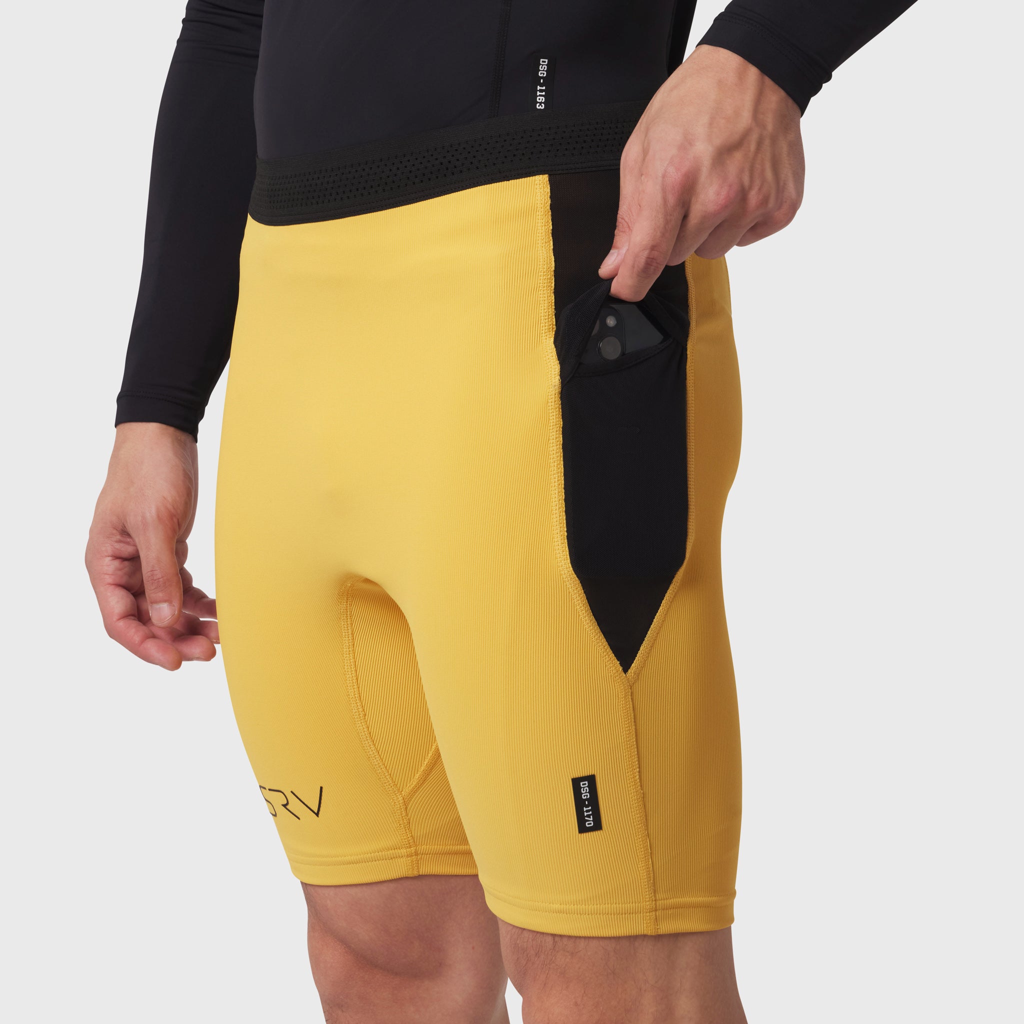 Lycra Ribbed Run Half-Tight shorts in amber yellow, worn by model, side view