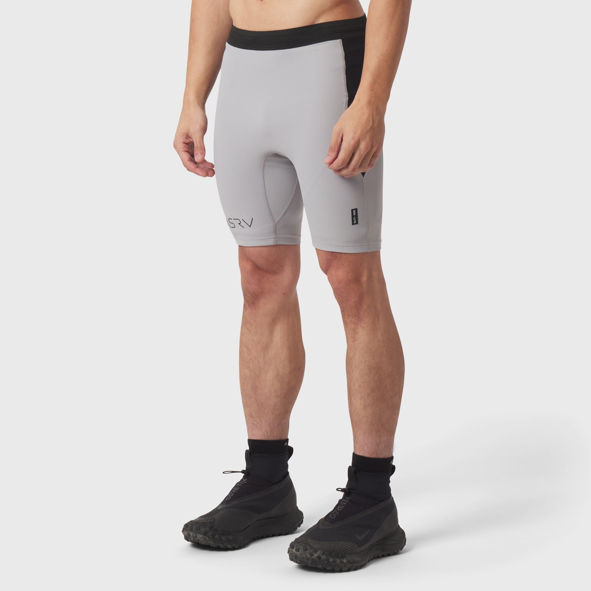 Lycra® Ribbed Run Half-Tight in slate grey, modeled front view with black socks and shoes