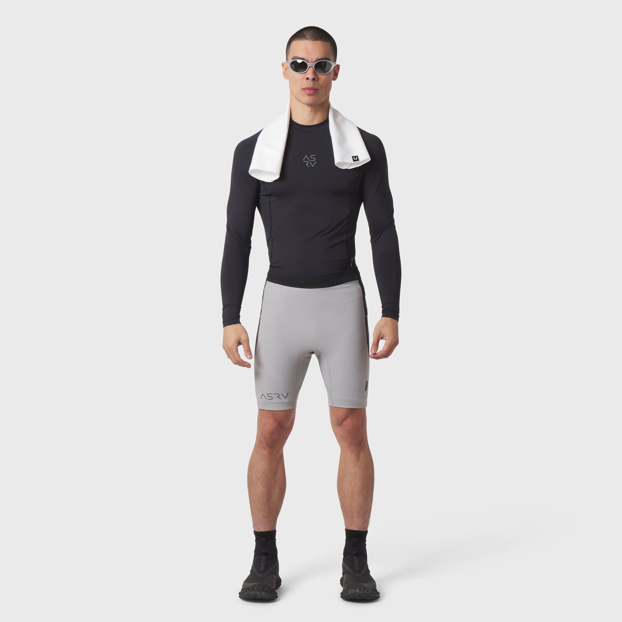 Lycra® Ribbed Run Half-Tight in slate grey, modeled with black long-sleeve top and white collar