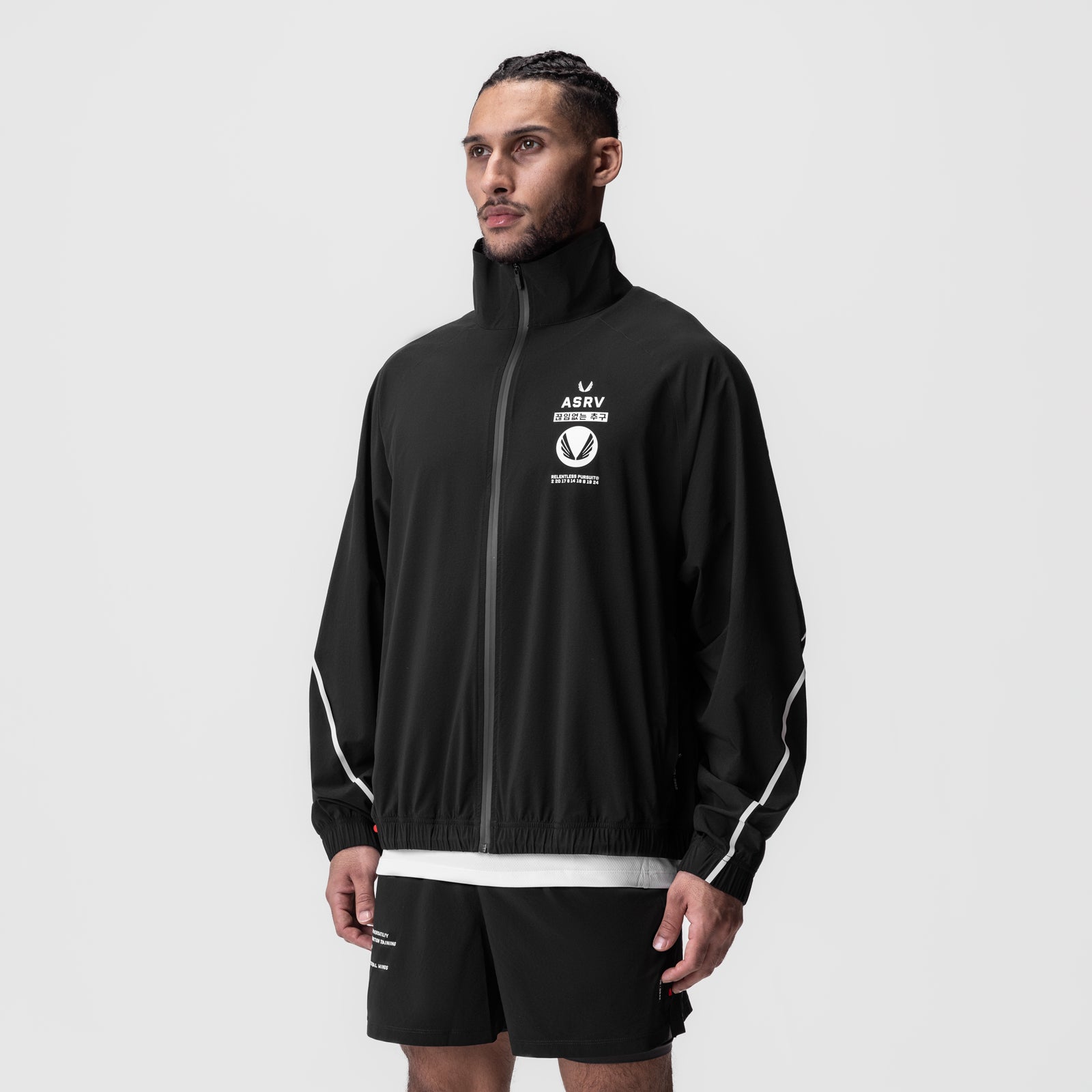Aerotex™ Track Jacket in black with white trim, worn by model, front view