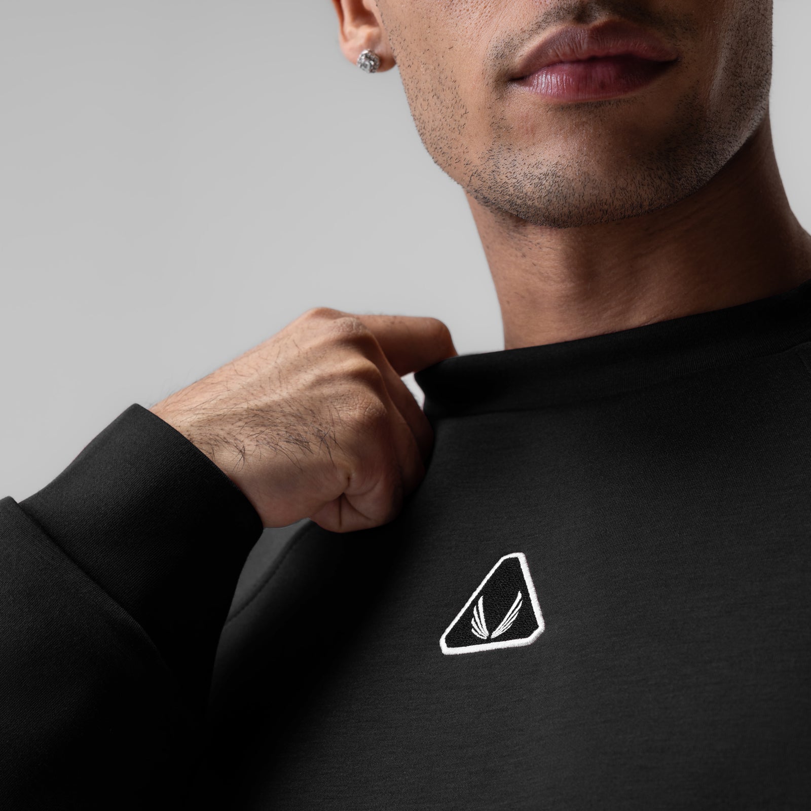 Dri-Core™ Oversized Crewneck in black worn by model, chest logo detail